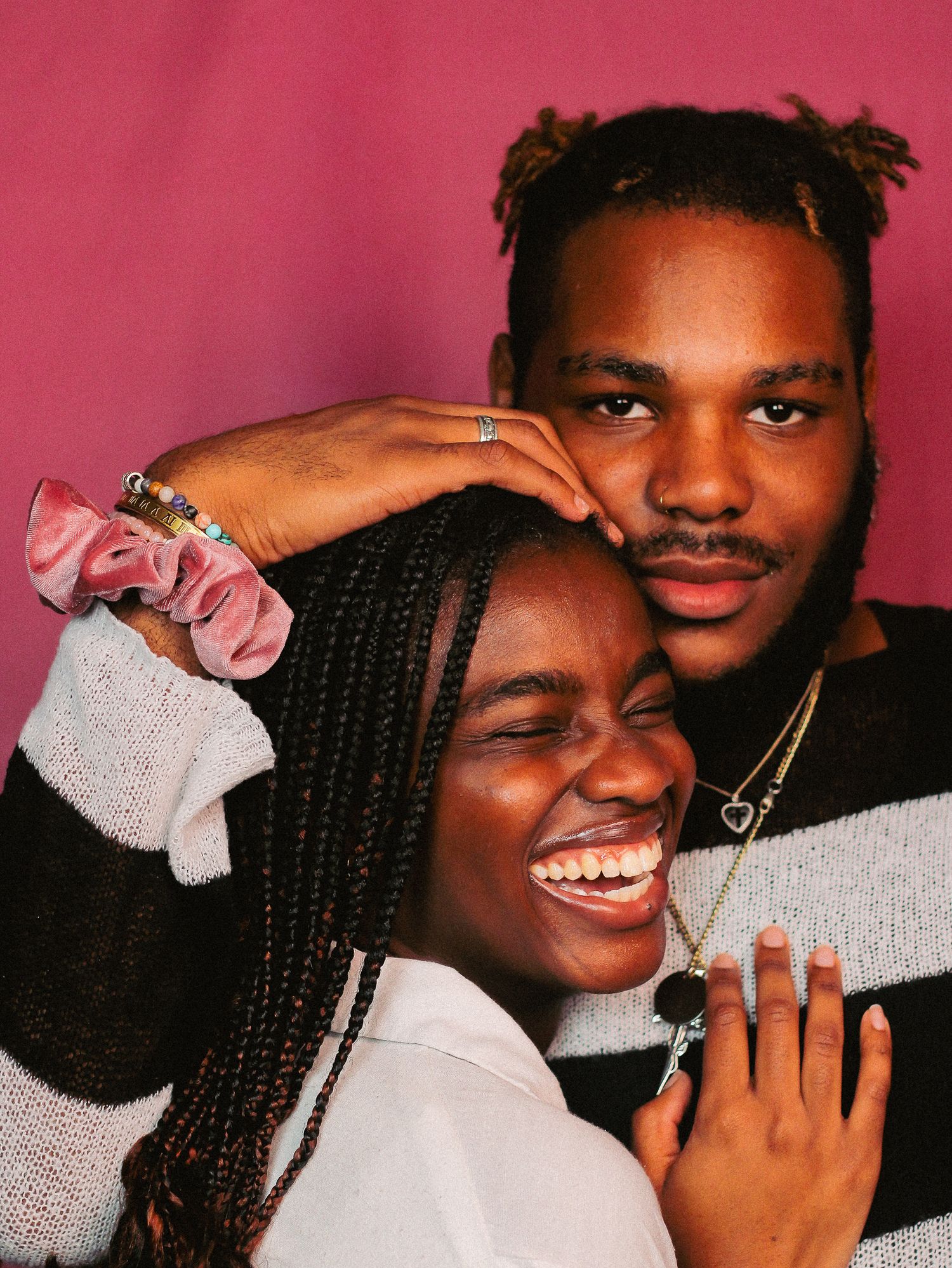 Series of candid moments showing genuine smiles and emotions against pink background.