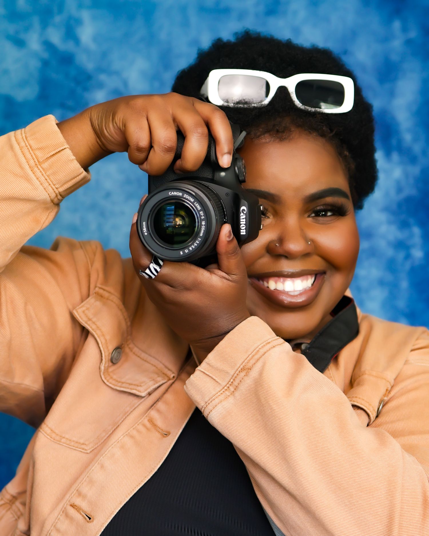Photography sequence showing camera equipment and peach-colored clothing against blue backdrop.