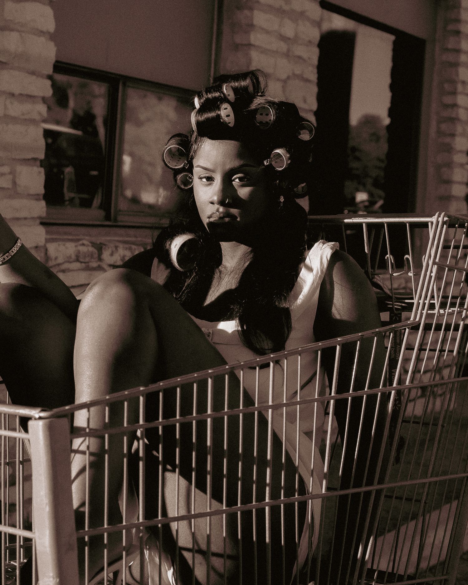 Sepia-toned artistic portrait sequence with dramatic shadows and architectural elements.