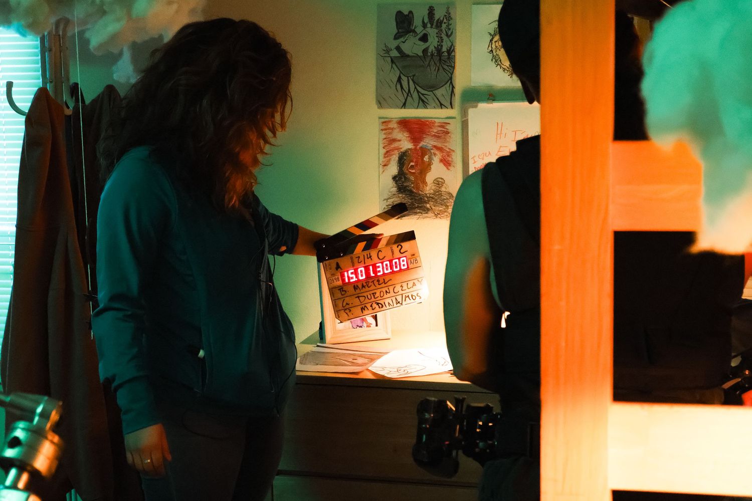 Film set with mixed orange and green lighting creating atmospheric mood.