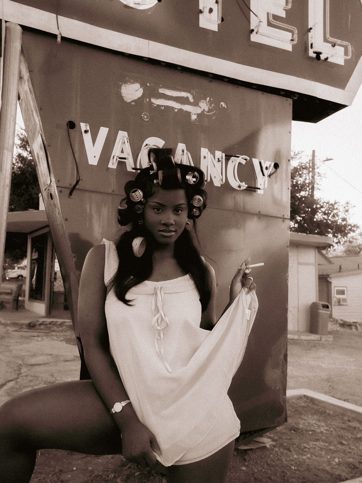 Artistic black and white portraits captured at a vintage motel setting.