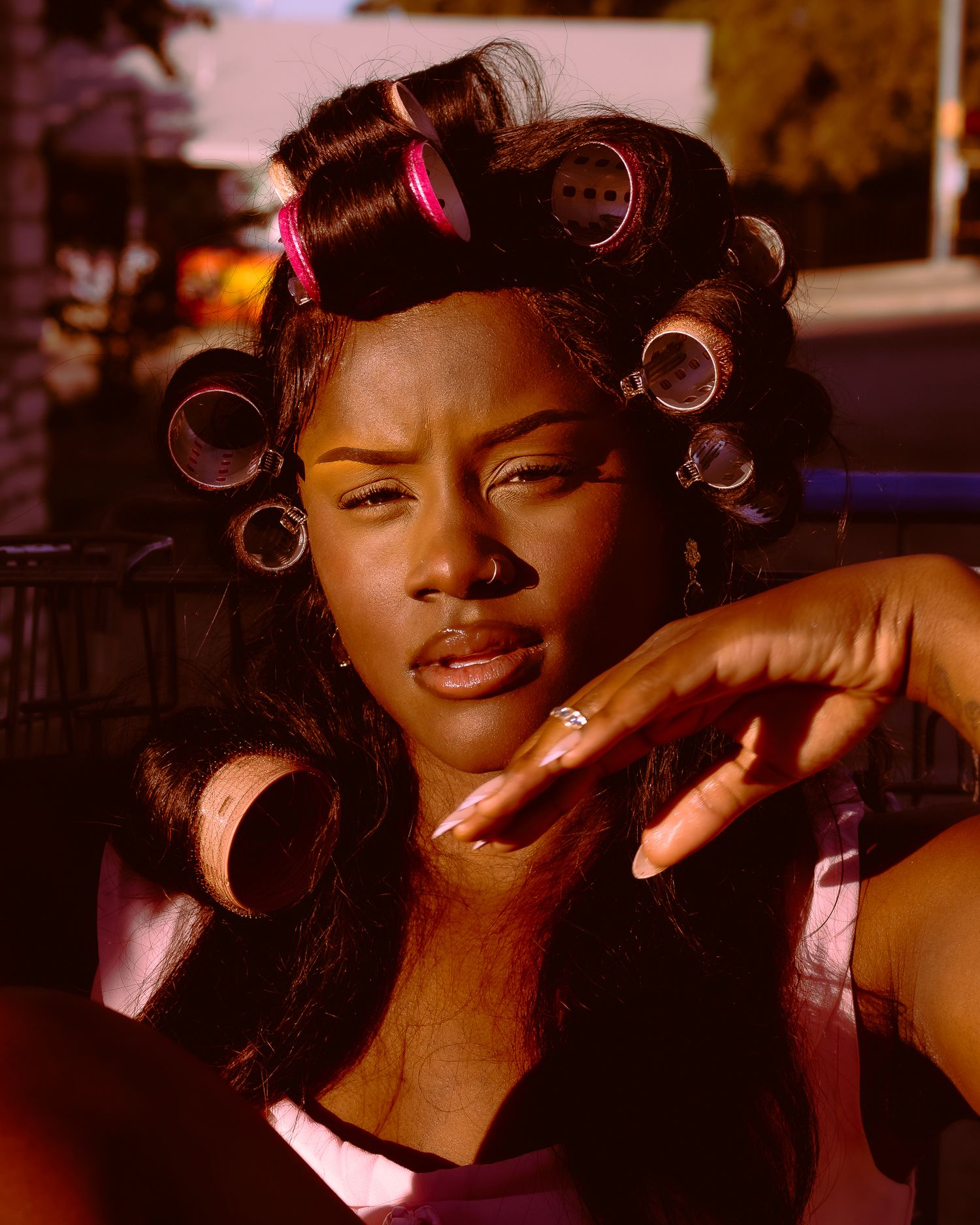 Beauty portrait sequence with hair rollers showing playful expressions in warm tones.