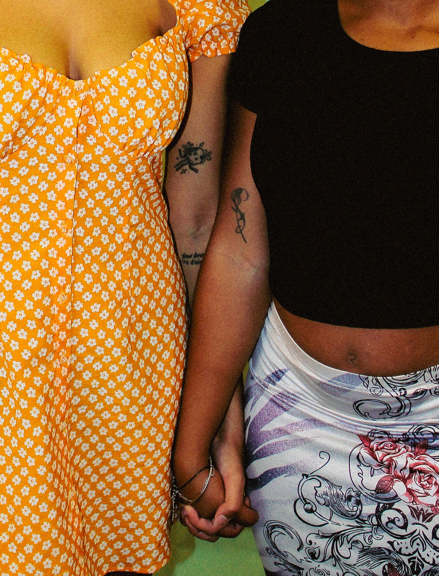Close-up detail of orange polka dot dress and casual summer fashion.