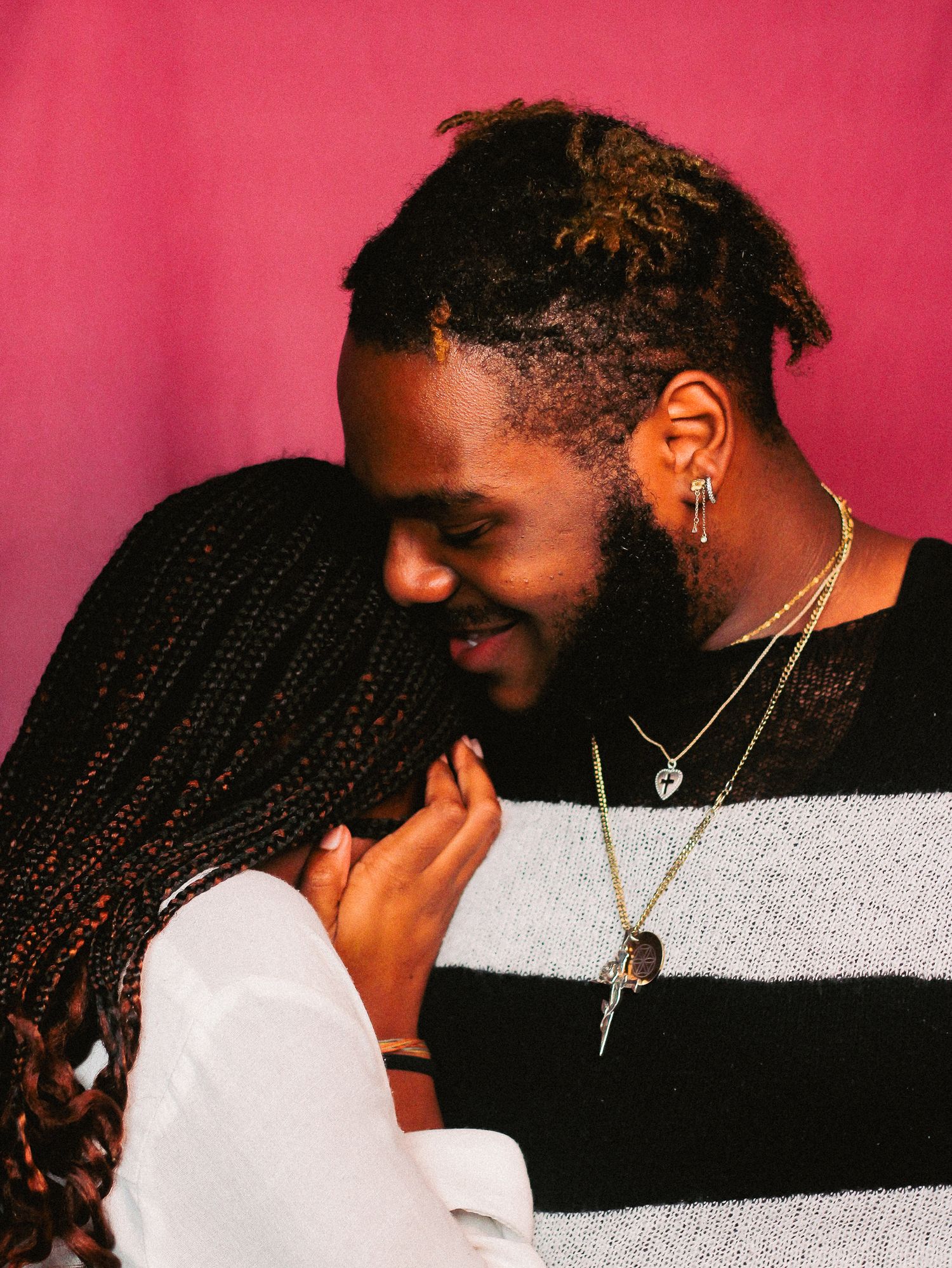 Intimate photo sequence against pink backdrop showing closeness and connection.