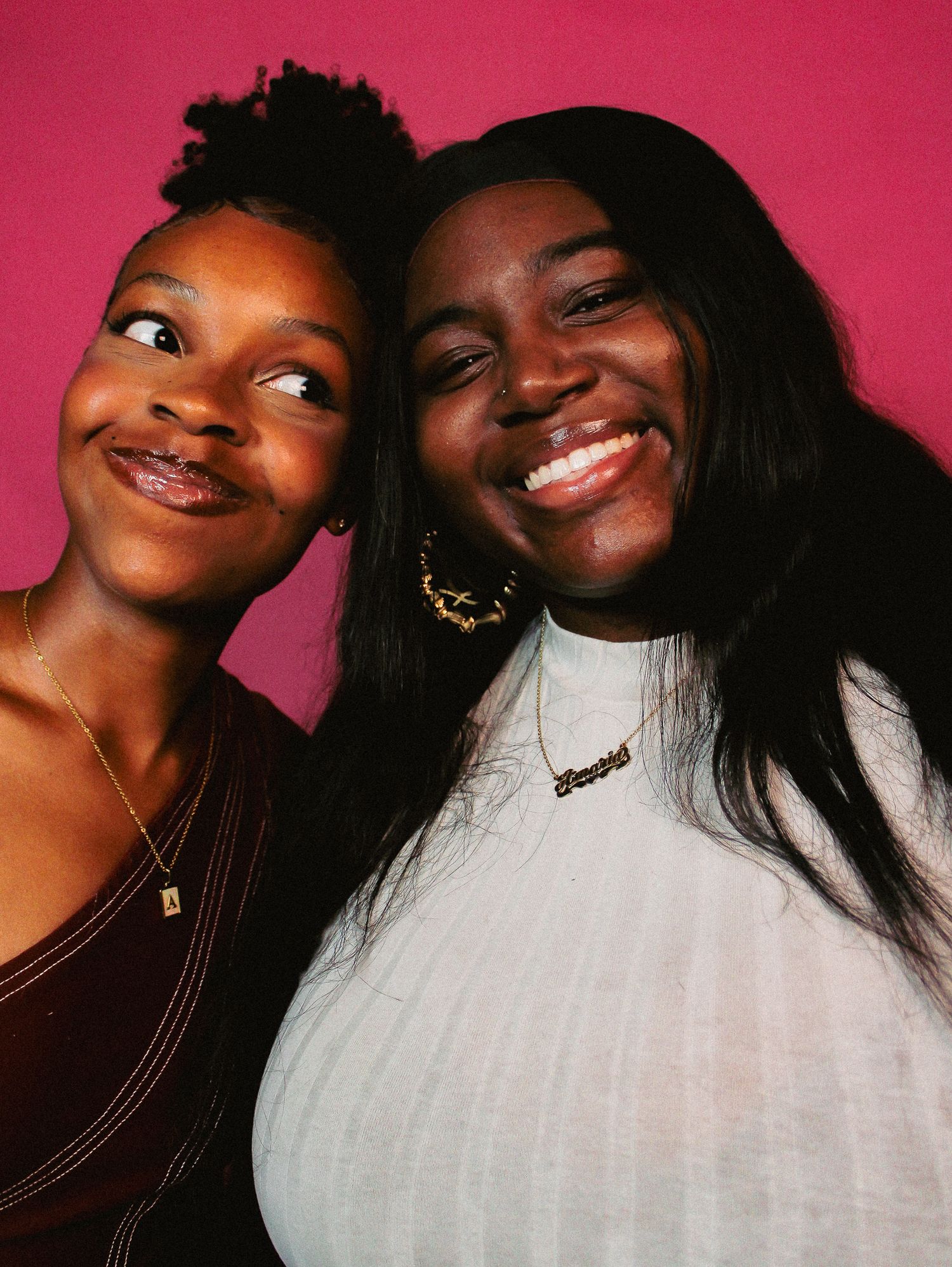 Close-up shots showing playful interactions between two friends on pink background.