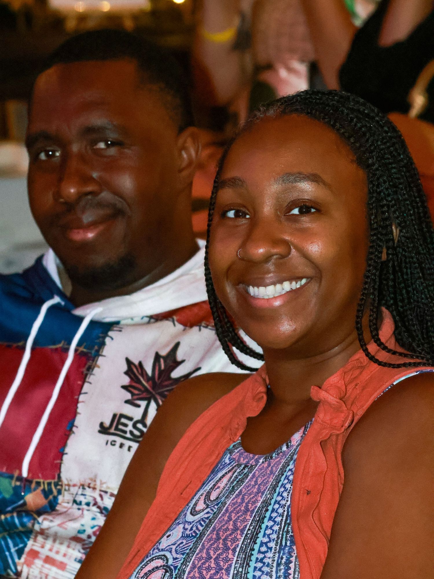 A group of people smiling together at a casual gathering.