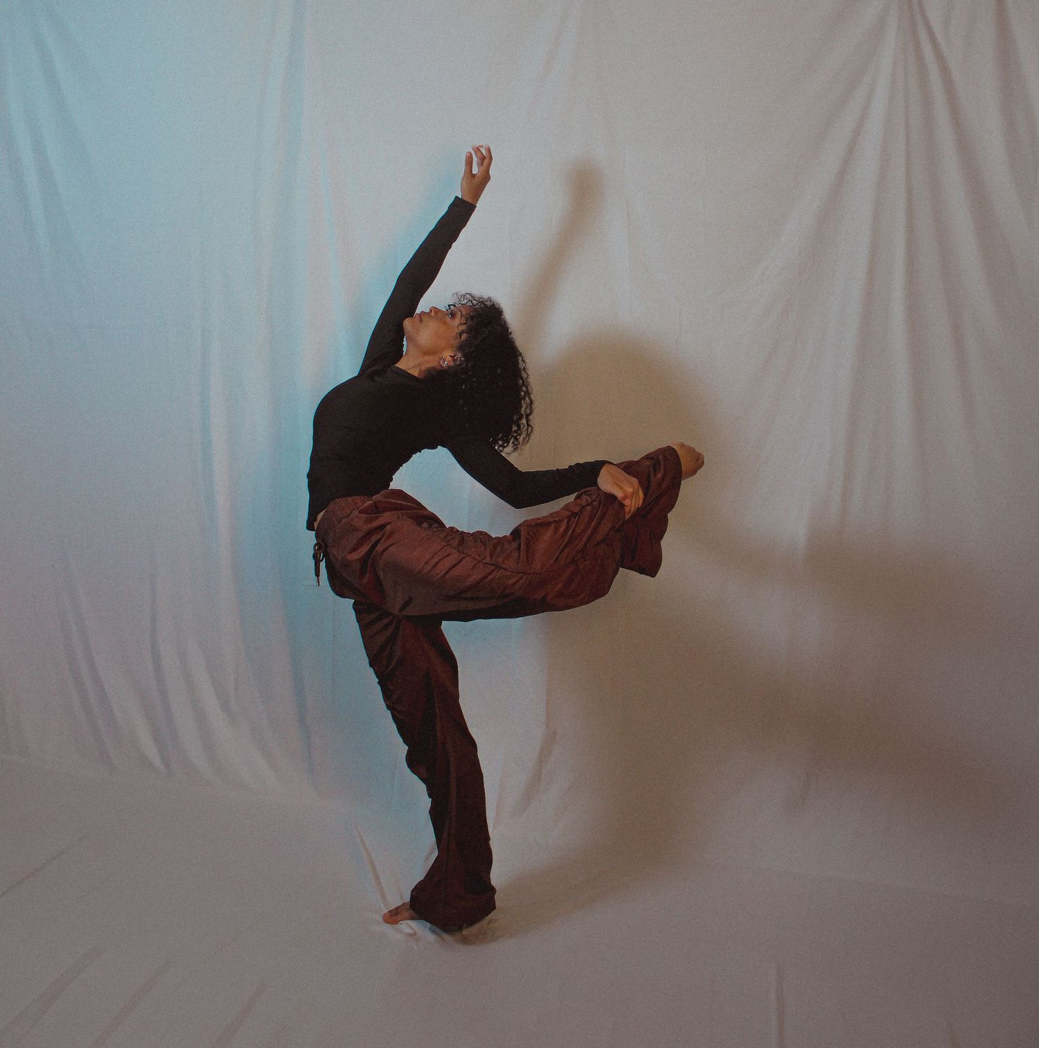 Modern dance movements captured in sequence against minimalist white background.