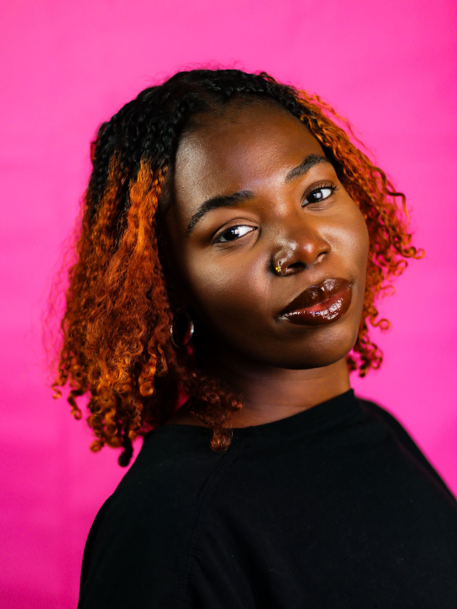 Close-up portrait series with copper-toned curls against vibrant pink background.