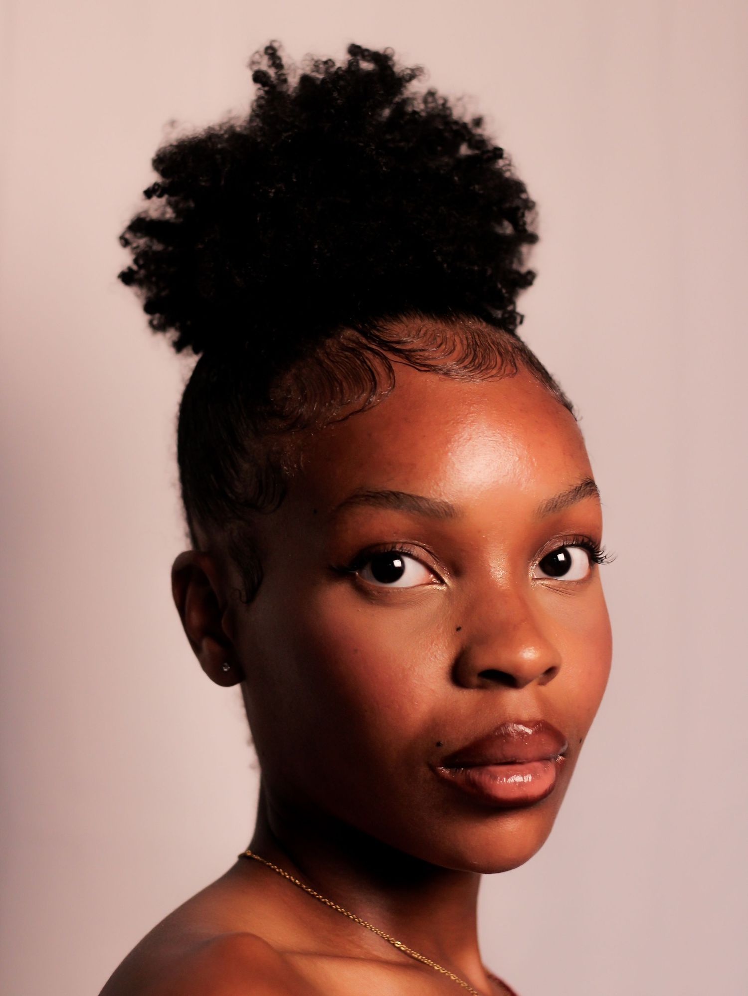 Artistic beauty portraits with dramatic lighting and confident poses.