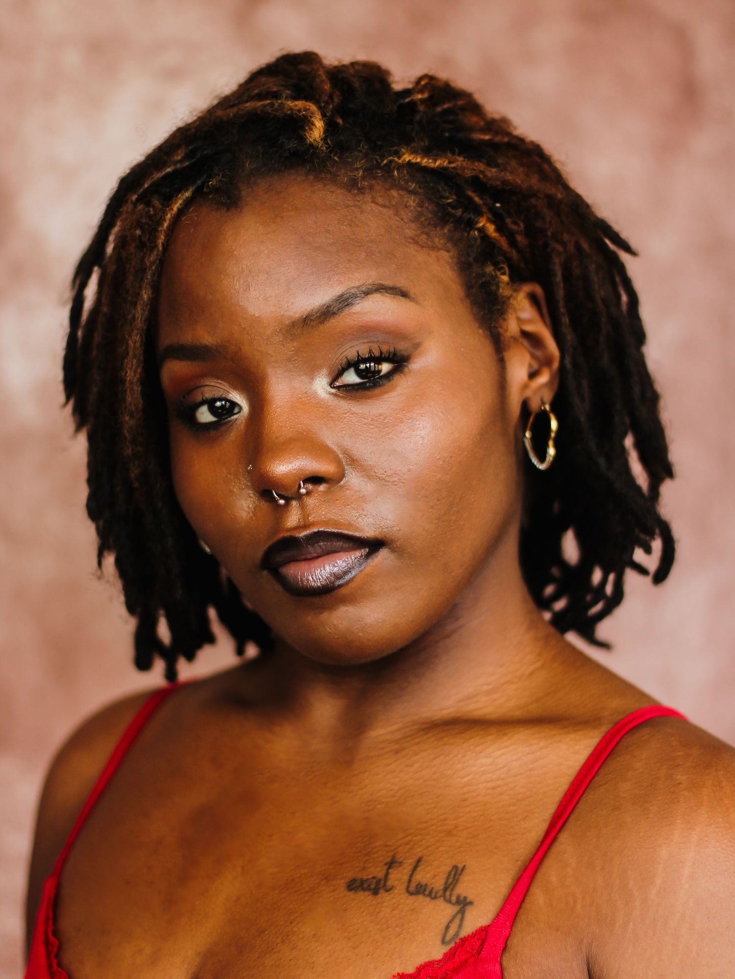 Close-up portrait series showing jewelry and red outfit against pink background.