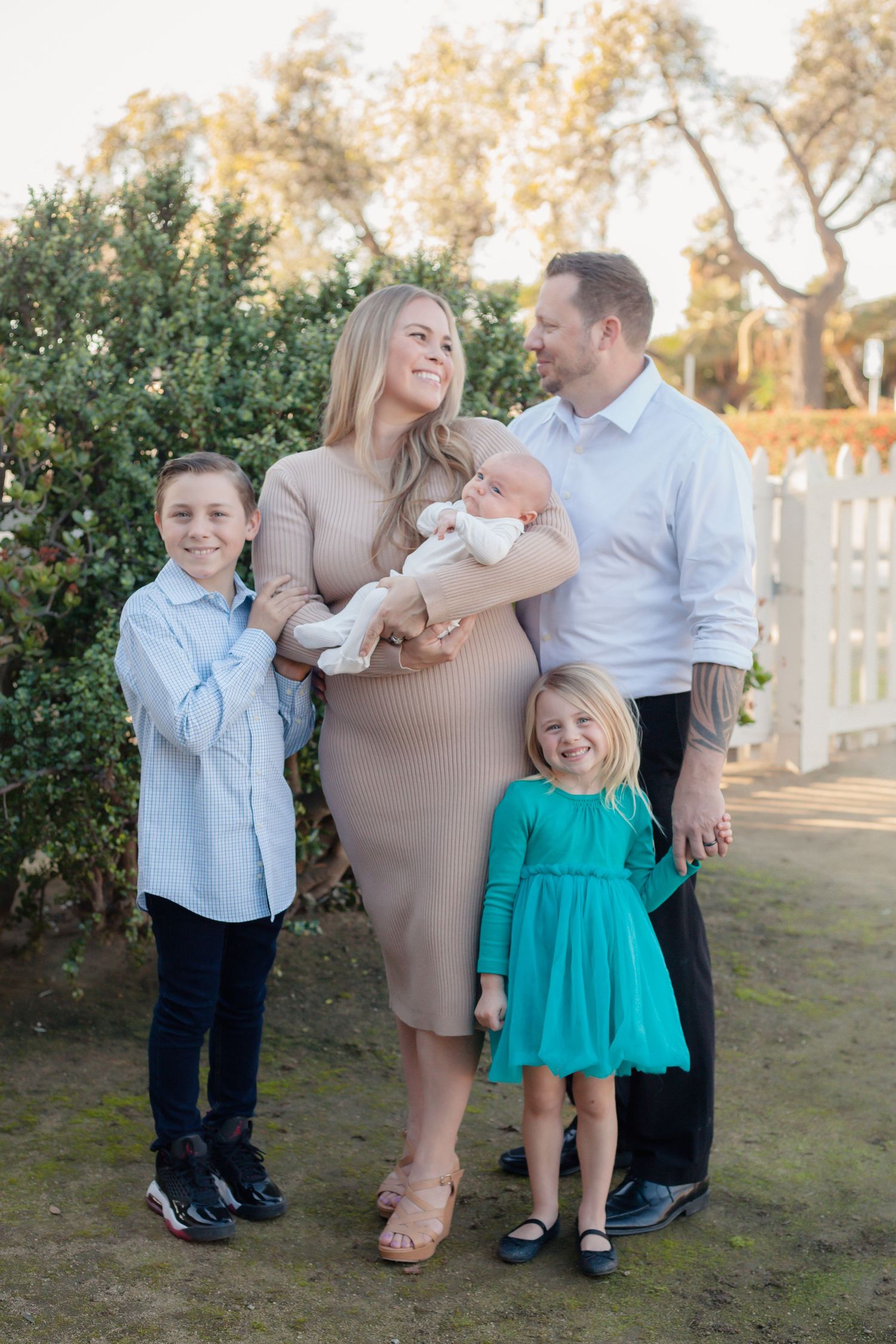 Happy family adds new addition. Family photos in Ventura, California.