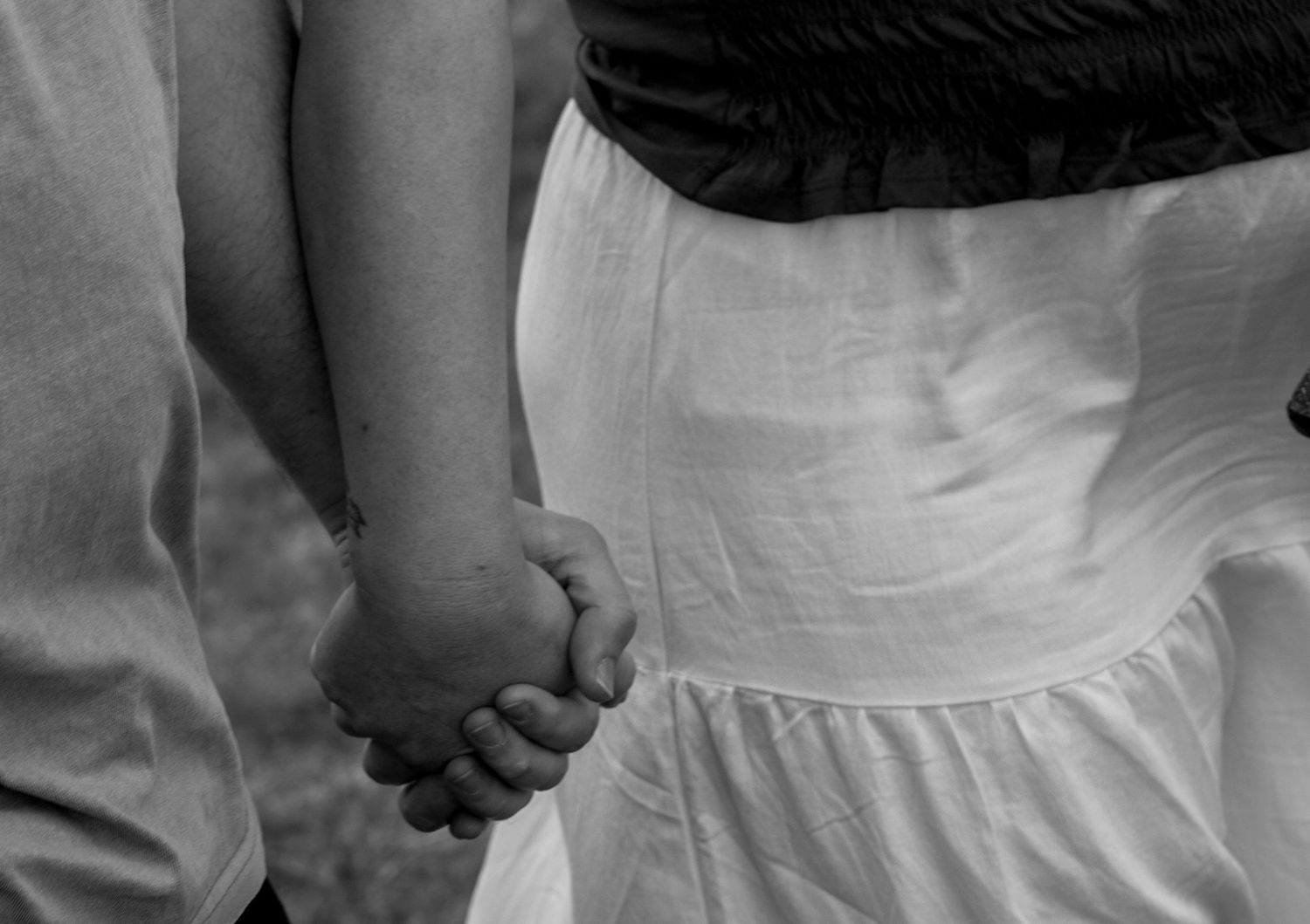 Two people holding hands