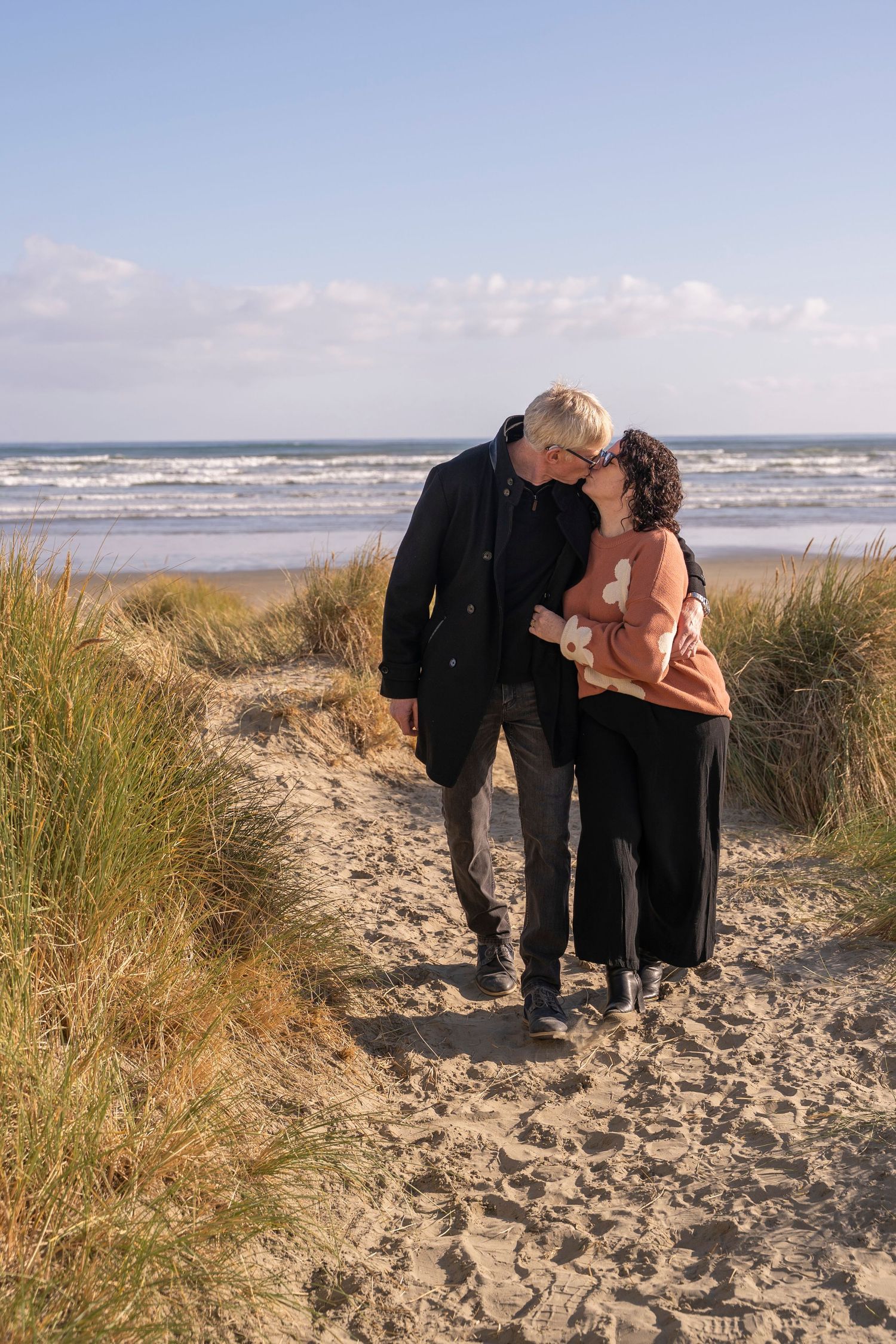 couple kissing on beach