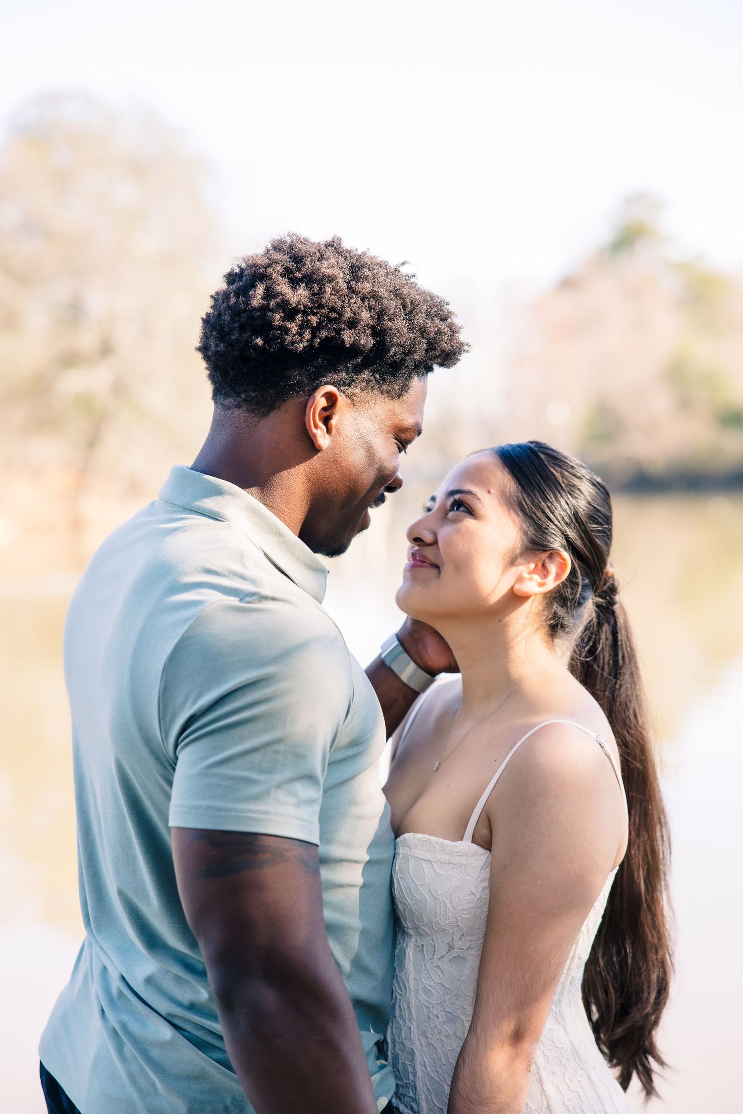 A romantic couple shares tender moments in a series of sunlit outdoor photos.