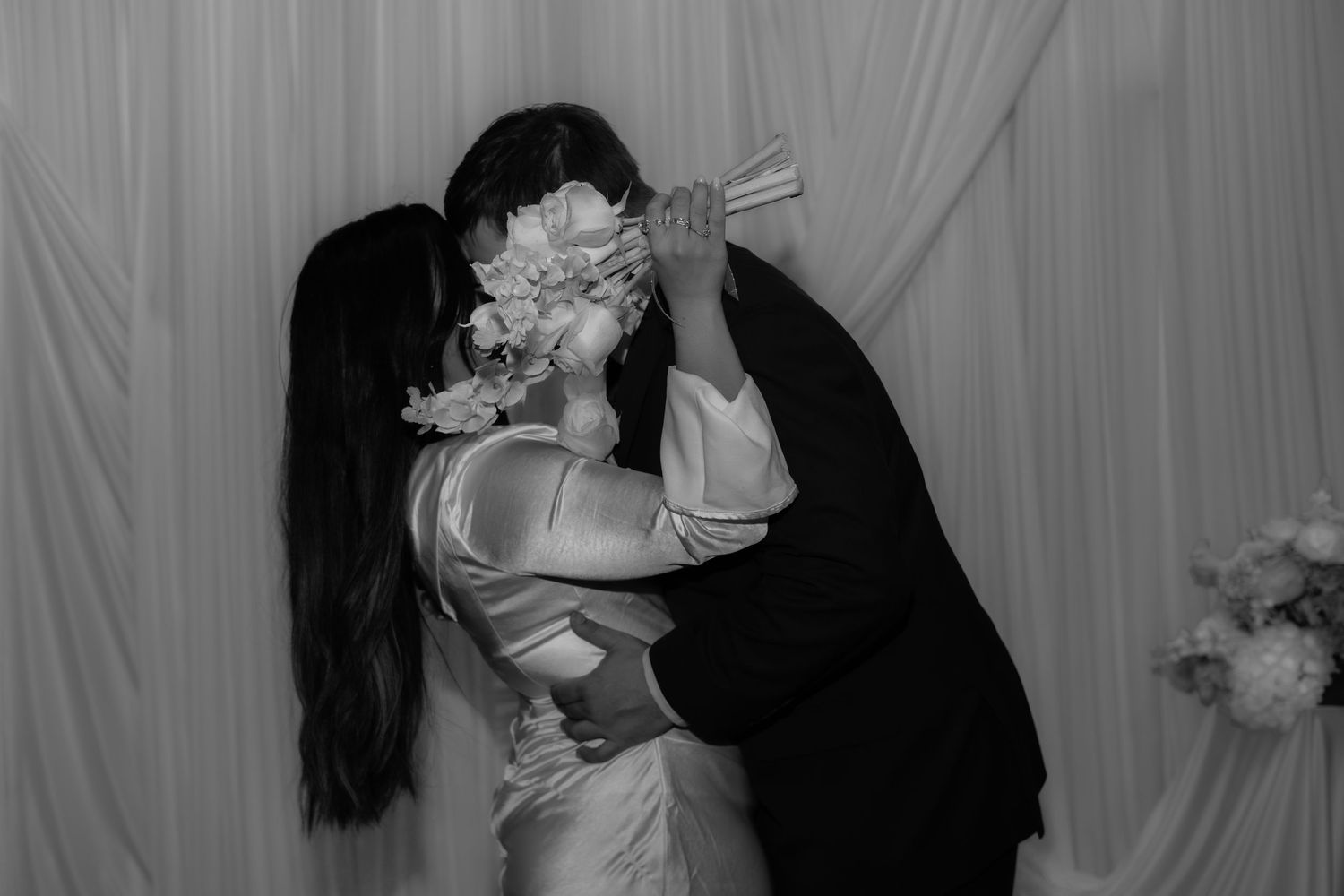 A romantic black and white photo sequence showing tender moments.
