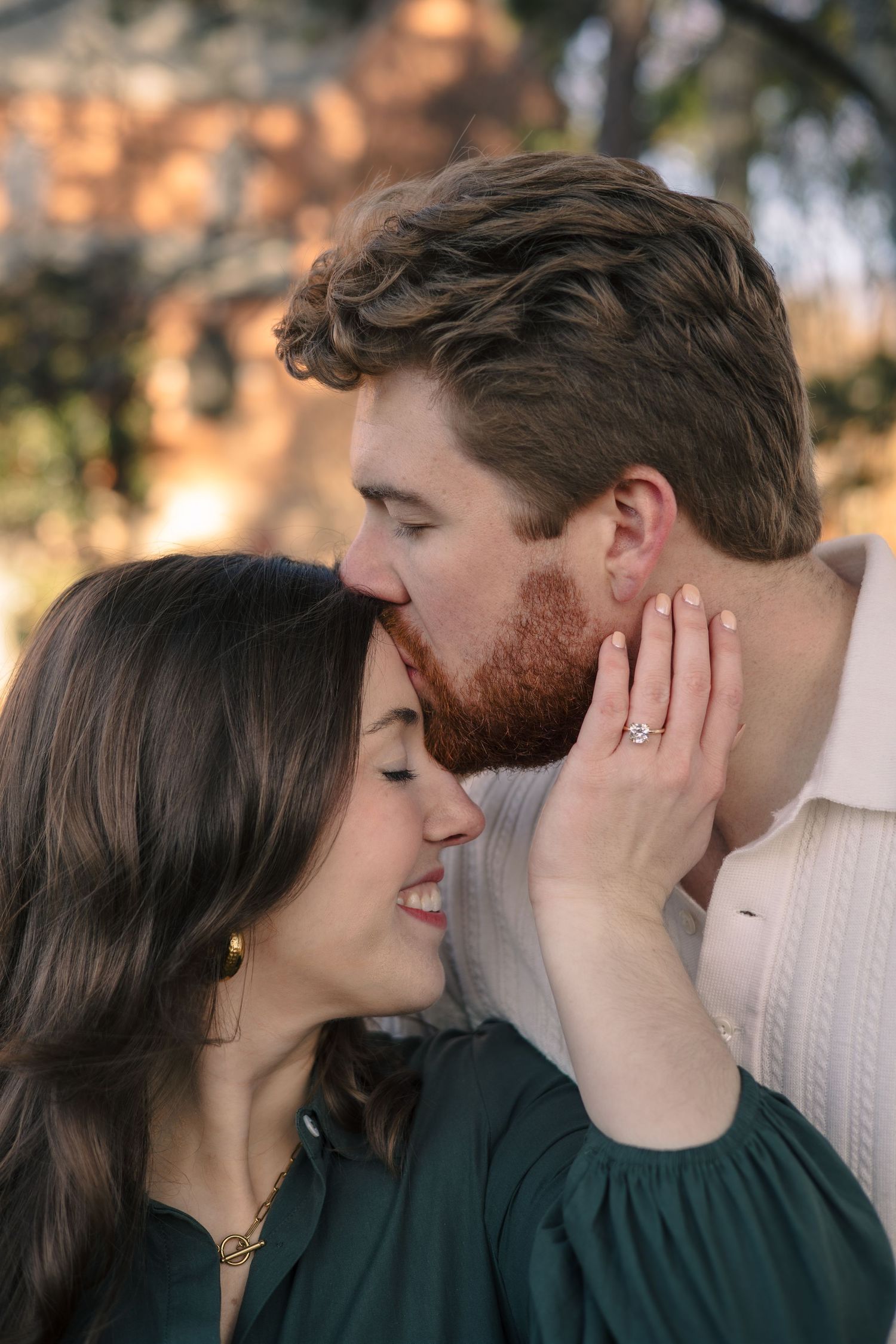 An intimate close-up moment between a couple during their engagement photoshoot.