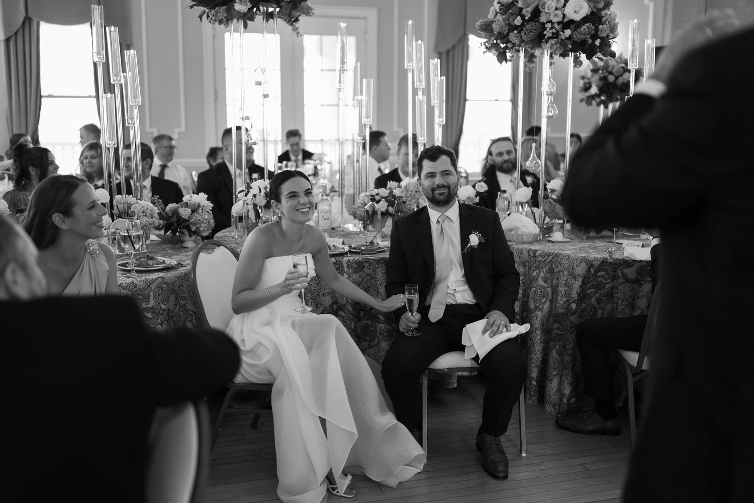 Black and white photos of a dance floor at a wedding reception with guests dancing and enjoying the celebration.