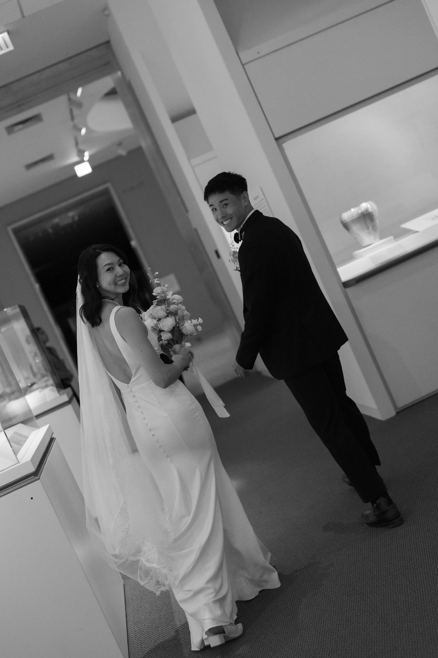 Wedding venue hallway with elegant interior and formal attire.