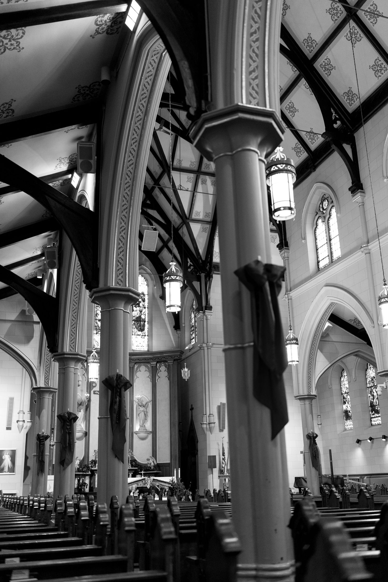 Interior of a gothic church with high arched ceilings and ornate architectural details.