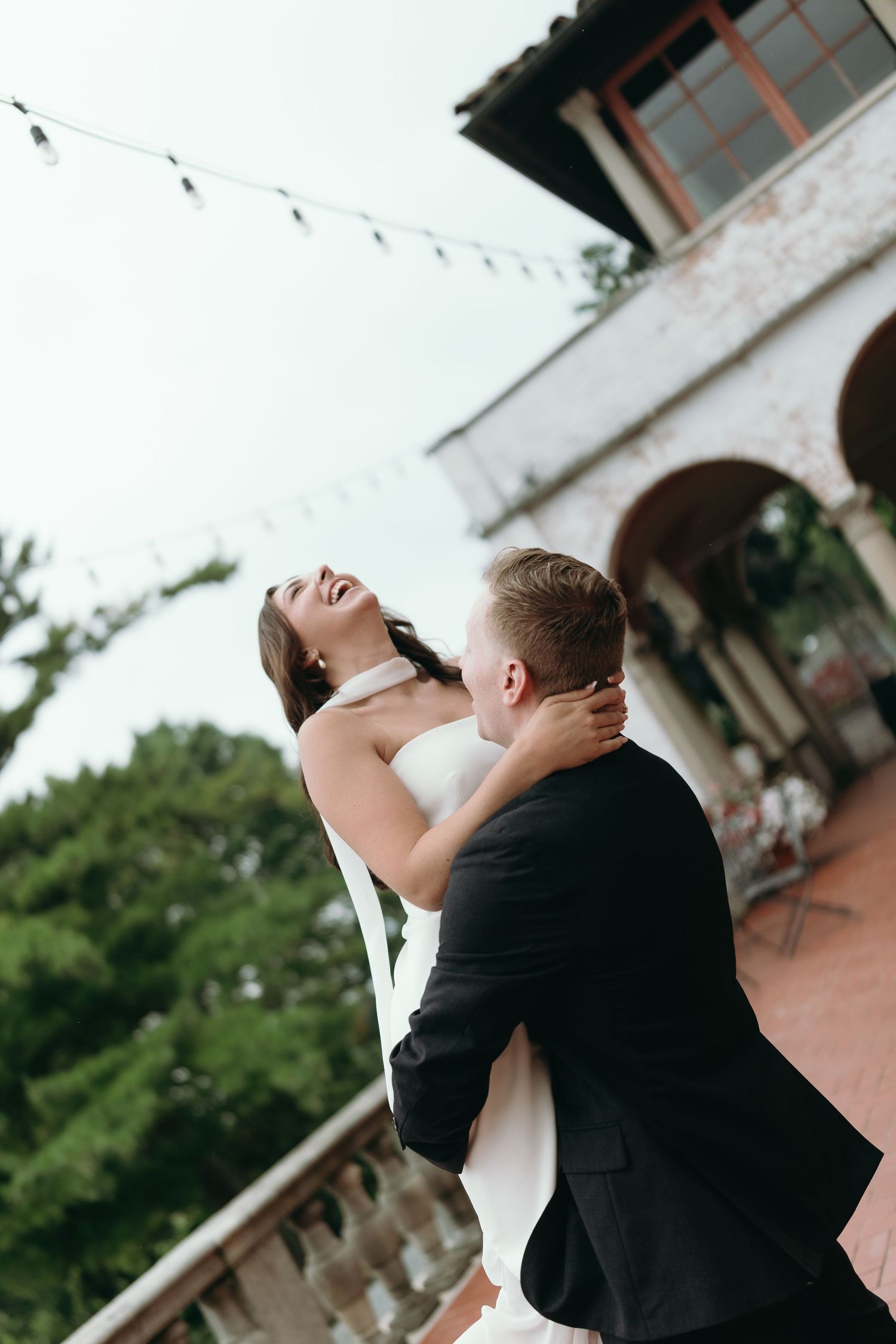 A couple shares a romantic dance moment during their wedding celebration, portrayed across multiple artistic angles.