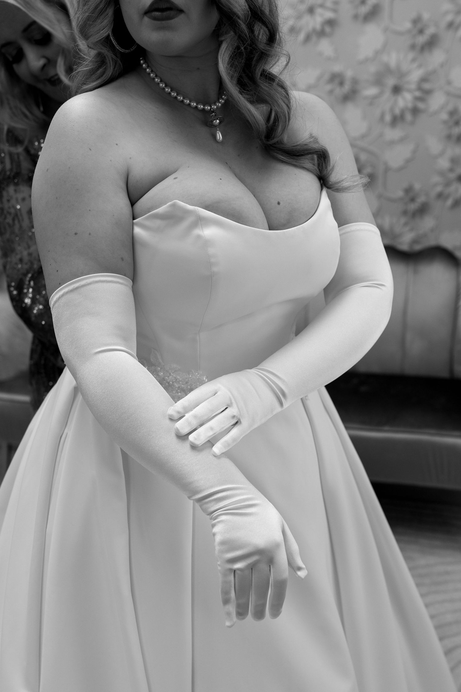 A graceful cascade of white formal gowns shown in an overlapping sequence.