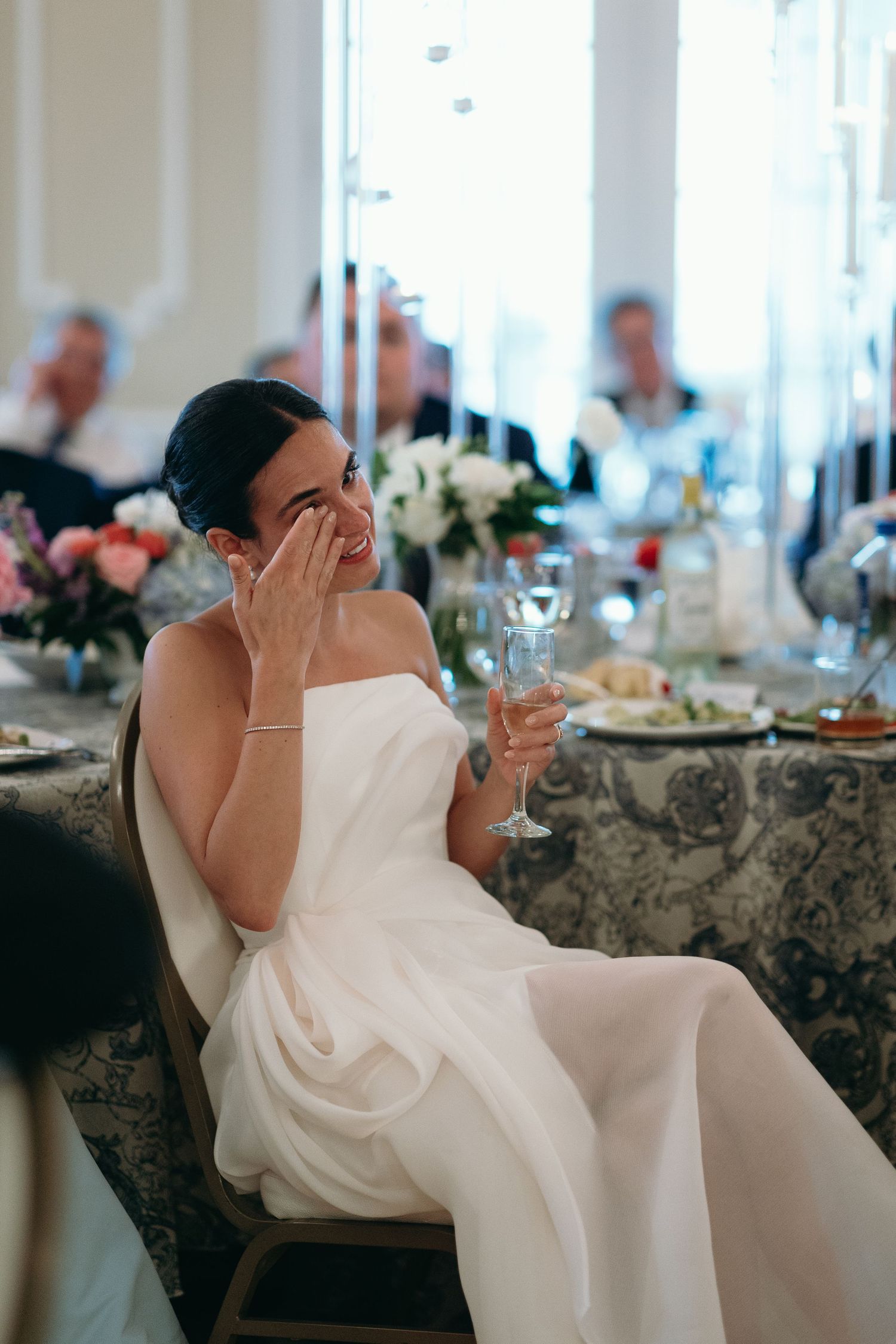 Three sequential photos show a bride in a white wedding dress sitting at a table with an emotional expression during a reception.