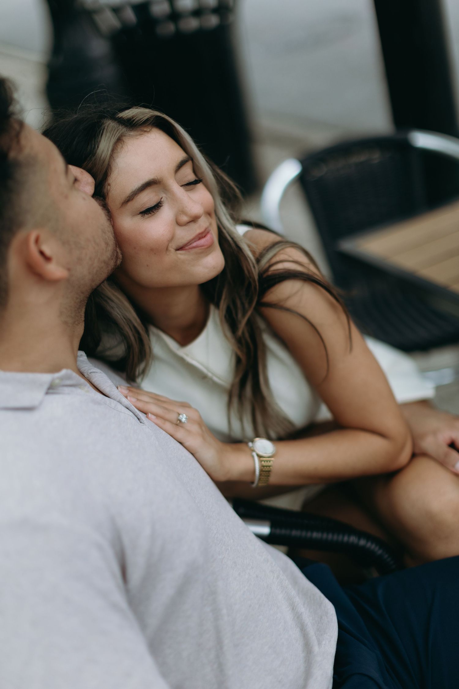 A romantic moment captured in a sequence showing an intimate couple sharing tender moments together on a couch.
