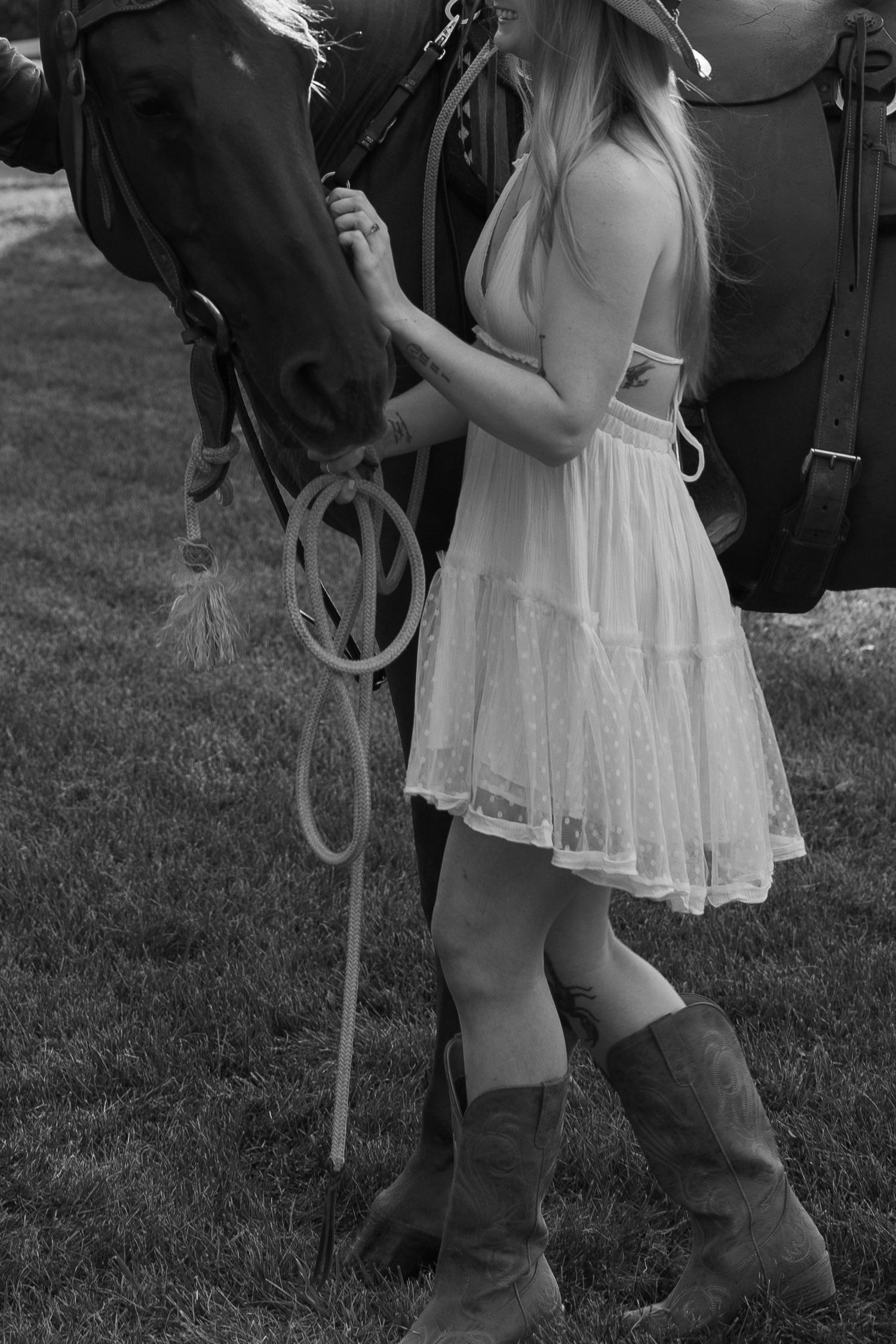 Cropped black and white photos showing someone in a white dress and boots standing next to a horse's legs.