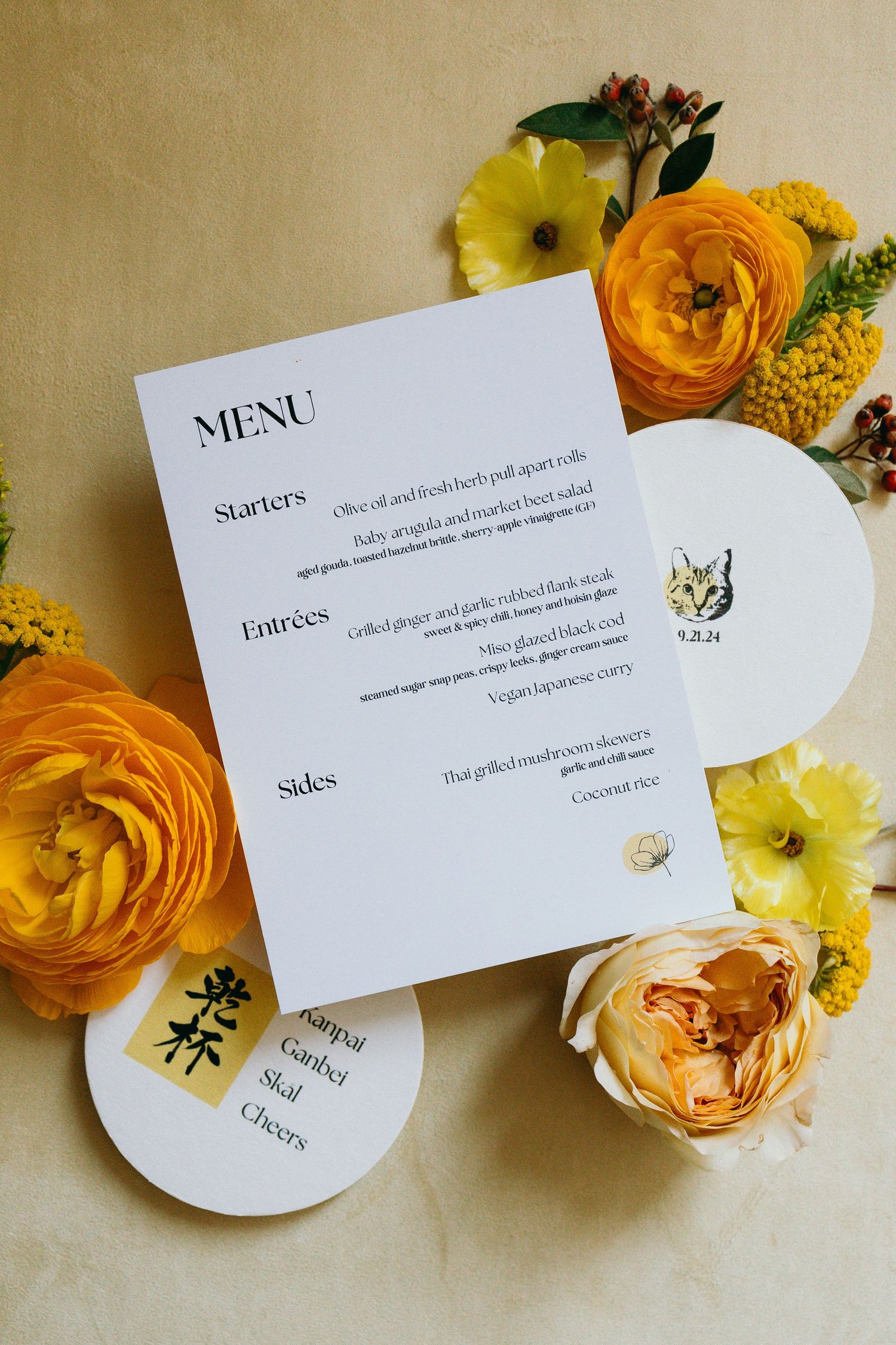 Wedding menu card styled with vibrant orange and yellow flowers on a light backdrop.