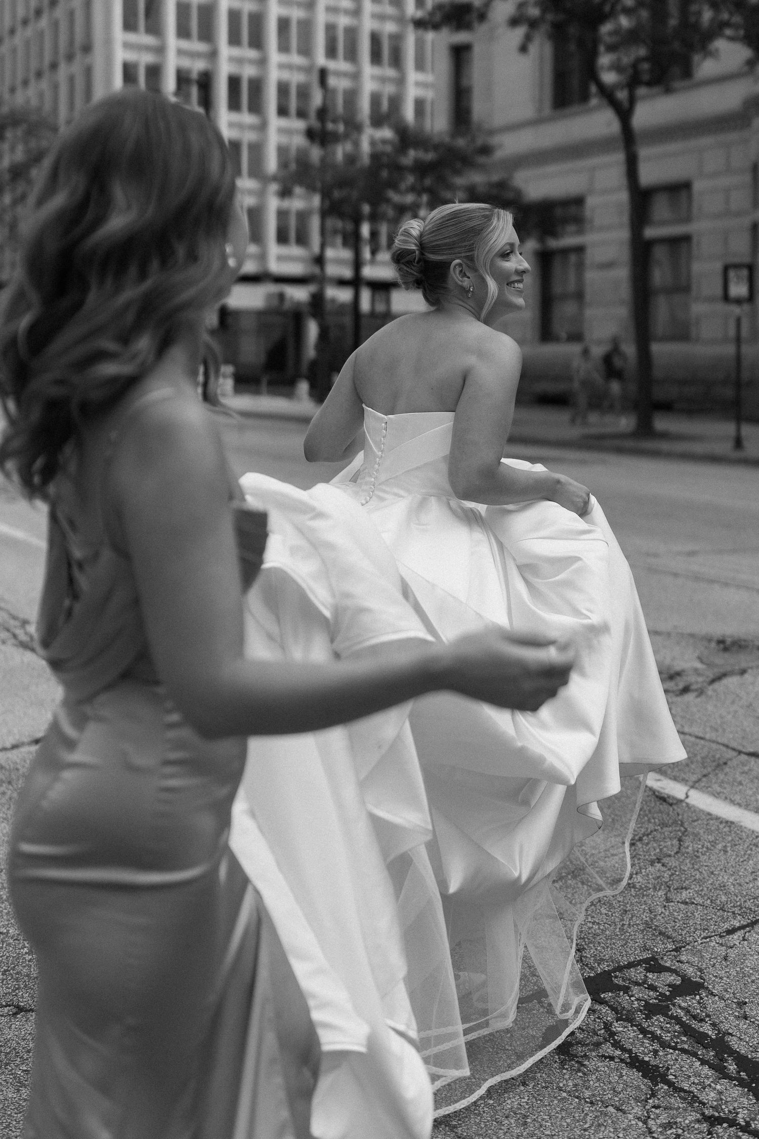 A sequence of photos shows a white dress blowing dramatically in the wind on a city street.
