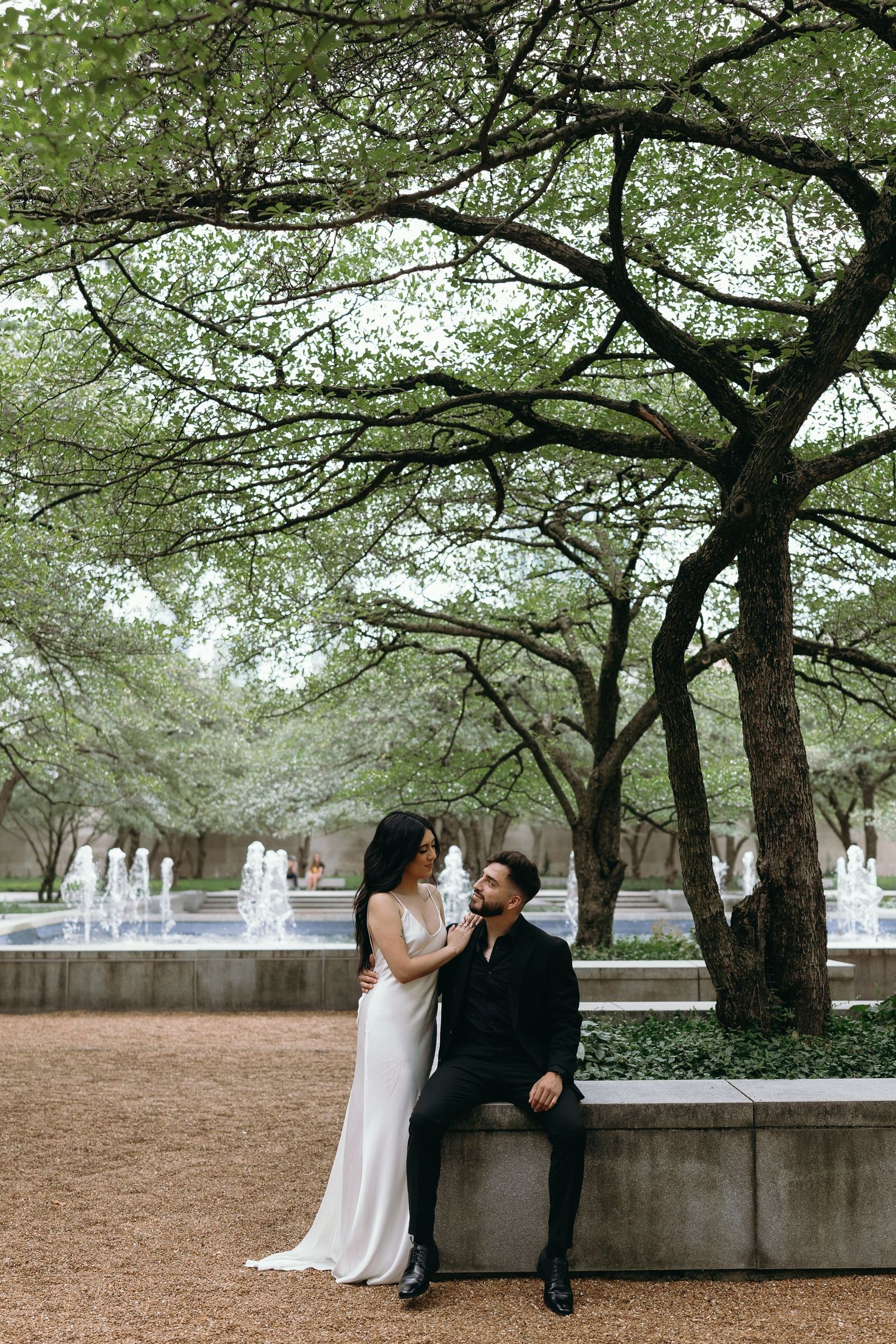 Engagement photos in Chicago Art Insitute South Garden. Chicago Wedding Photographer capturing engagement photos