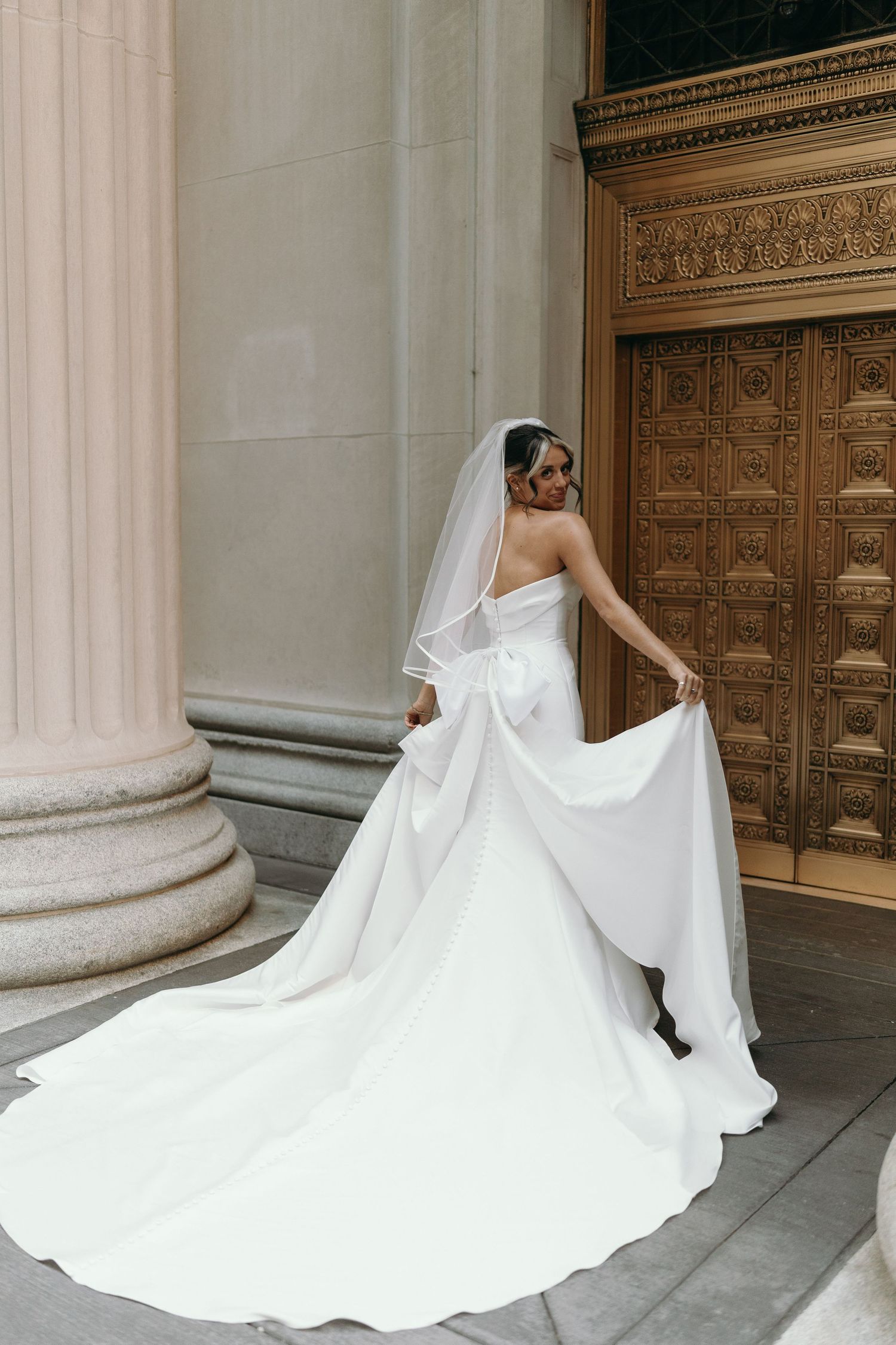 Luxury Chicago wedding photography featuring classic Financial District architecture and black tie wedding style.
