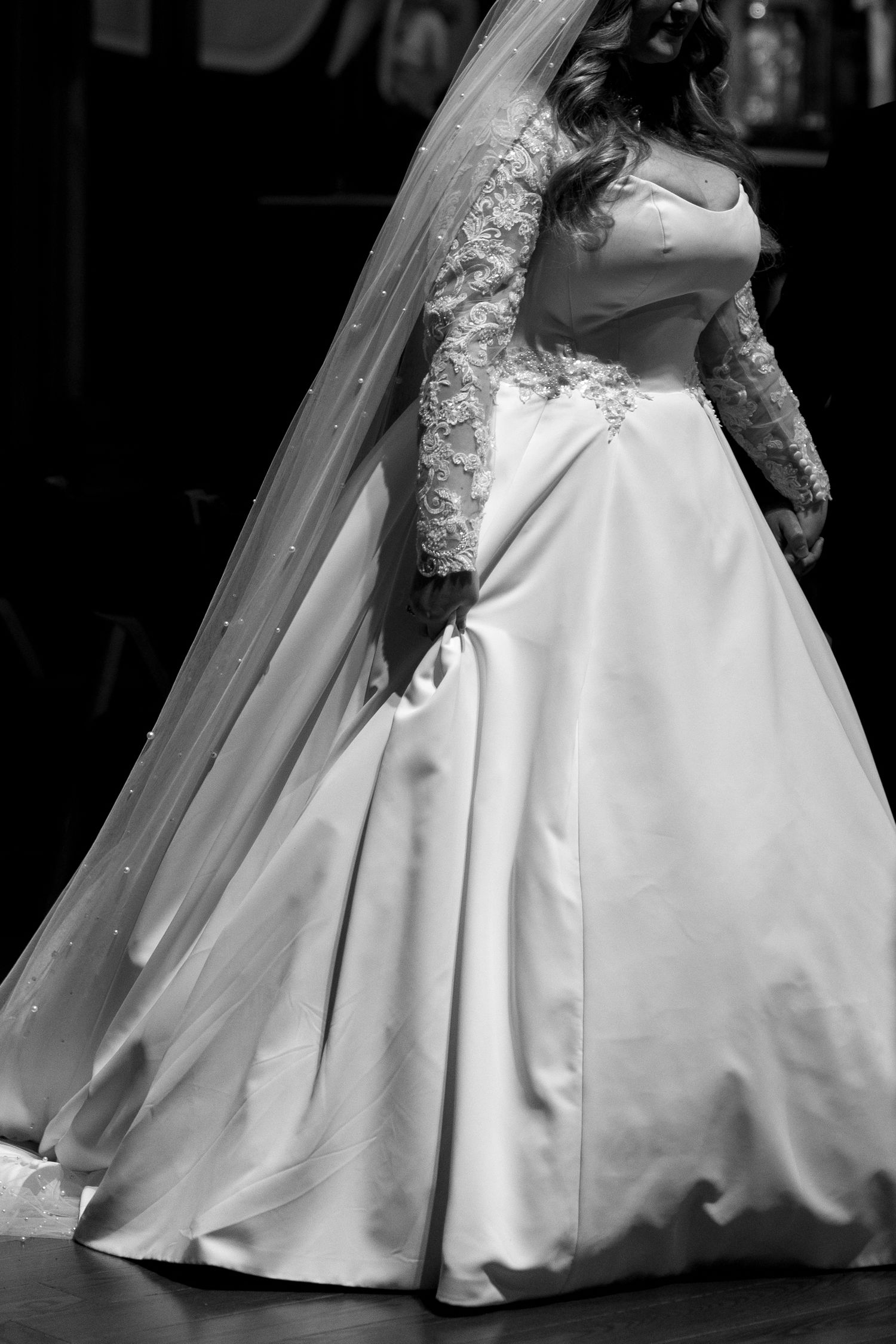 The flowing fabric of a white wedding gown captured in overlapping detail shots.