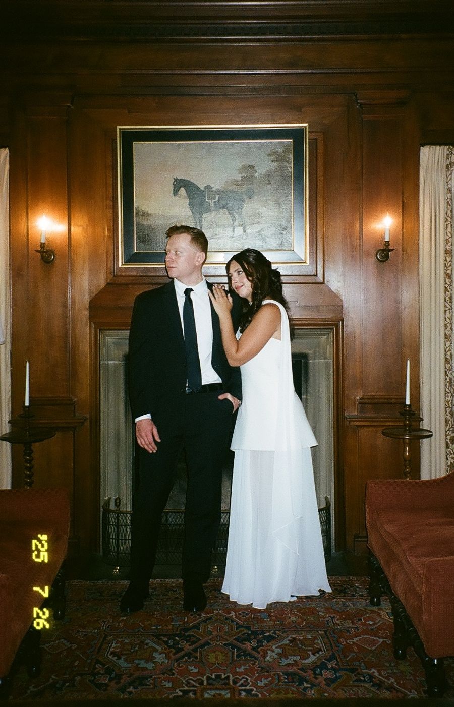 Candid sequence showing a couple in formal attire dancing across an elegant paneled room with hardwood walls.