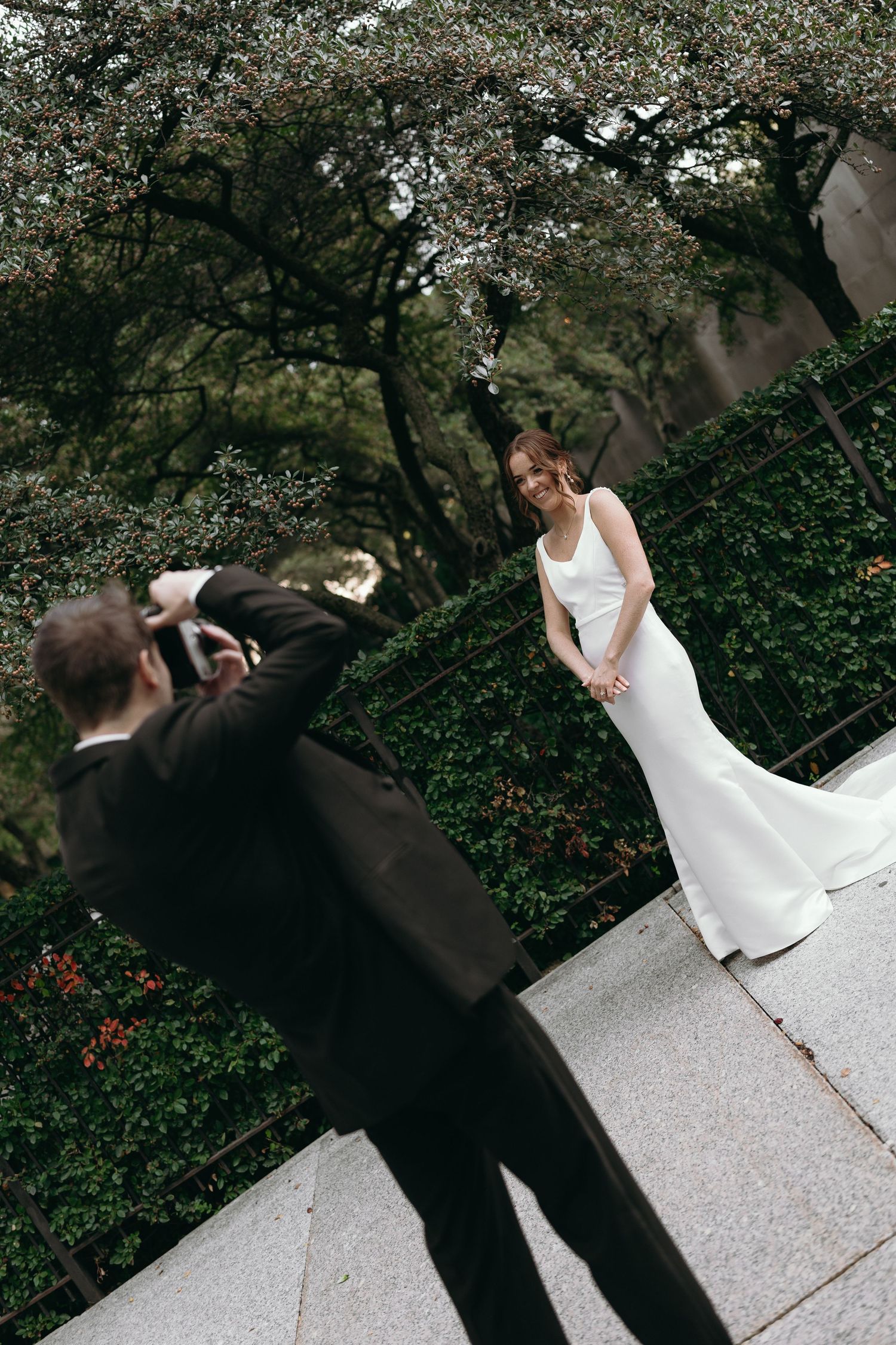 A sequence of photos shows a bride in a white dress twirling and dancing with a figure in black formal wear.
