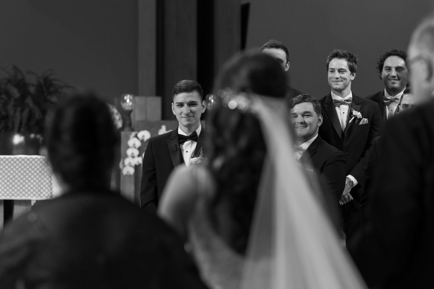 Black and white ceremony groom reaction.
