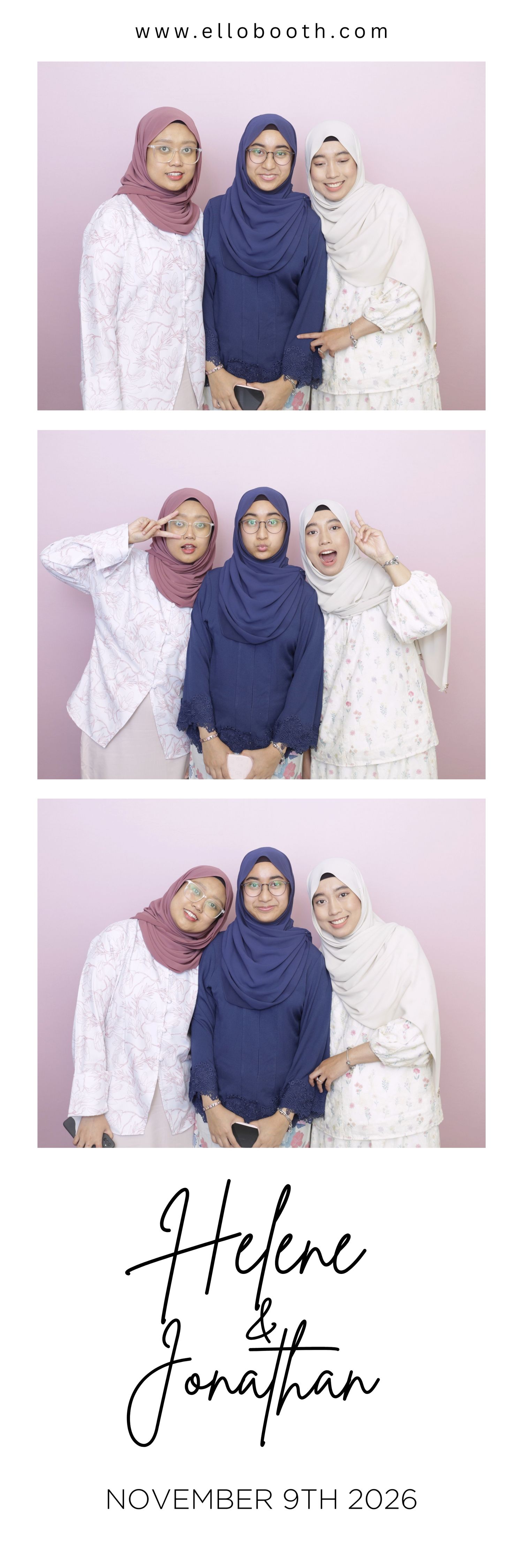 Three women in hijabs posing in a photo booth against a light pink background. They are smiling and making playful gestures.