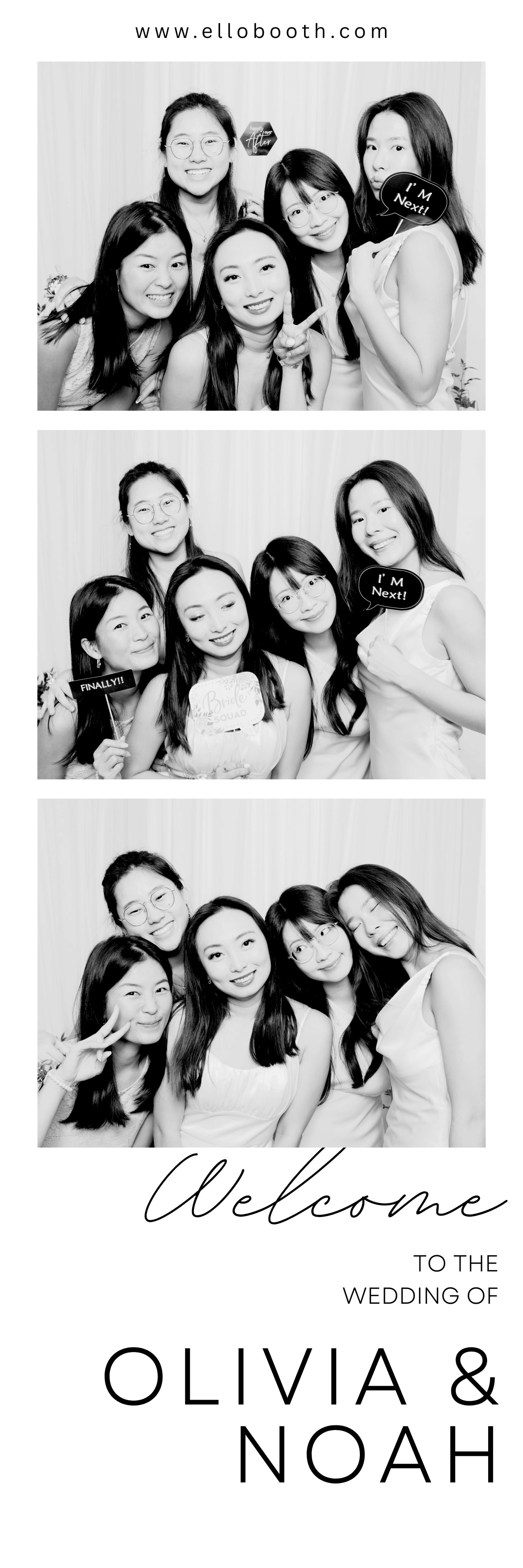 Black and white photo booth strip of five smiling women posing playfully with props.
