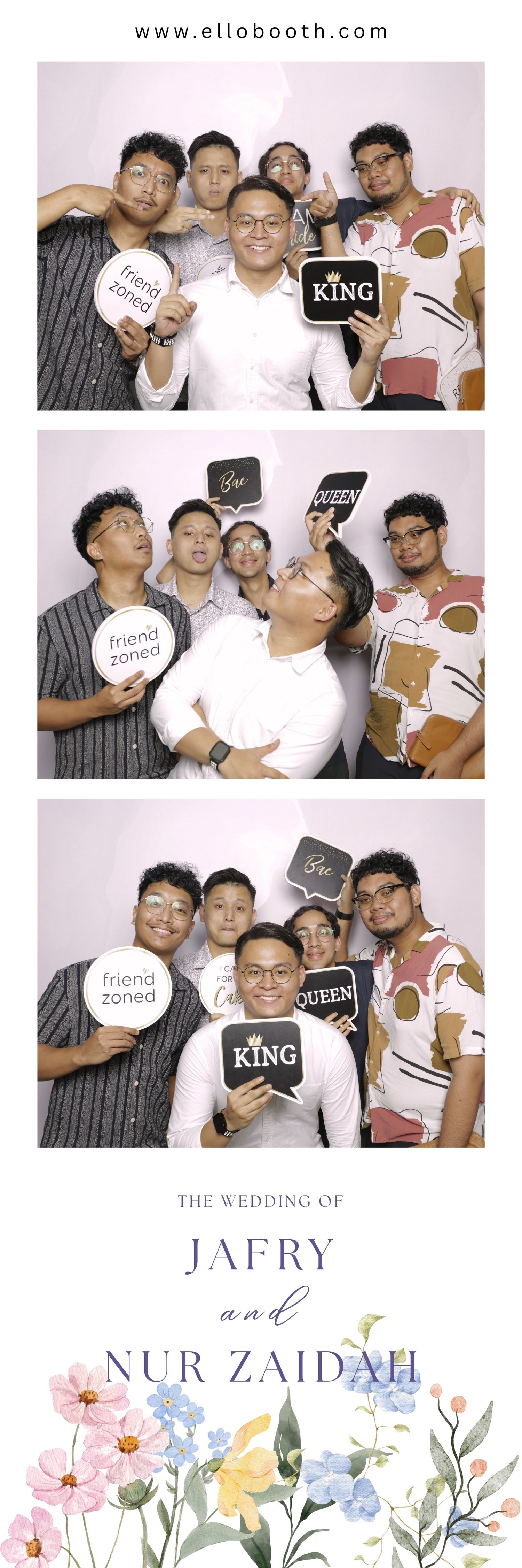 Group of five smiling friends in a photobooth, holding playful signs like 