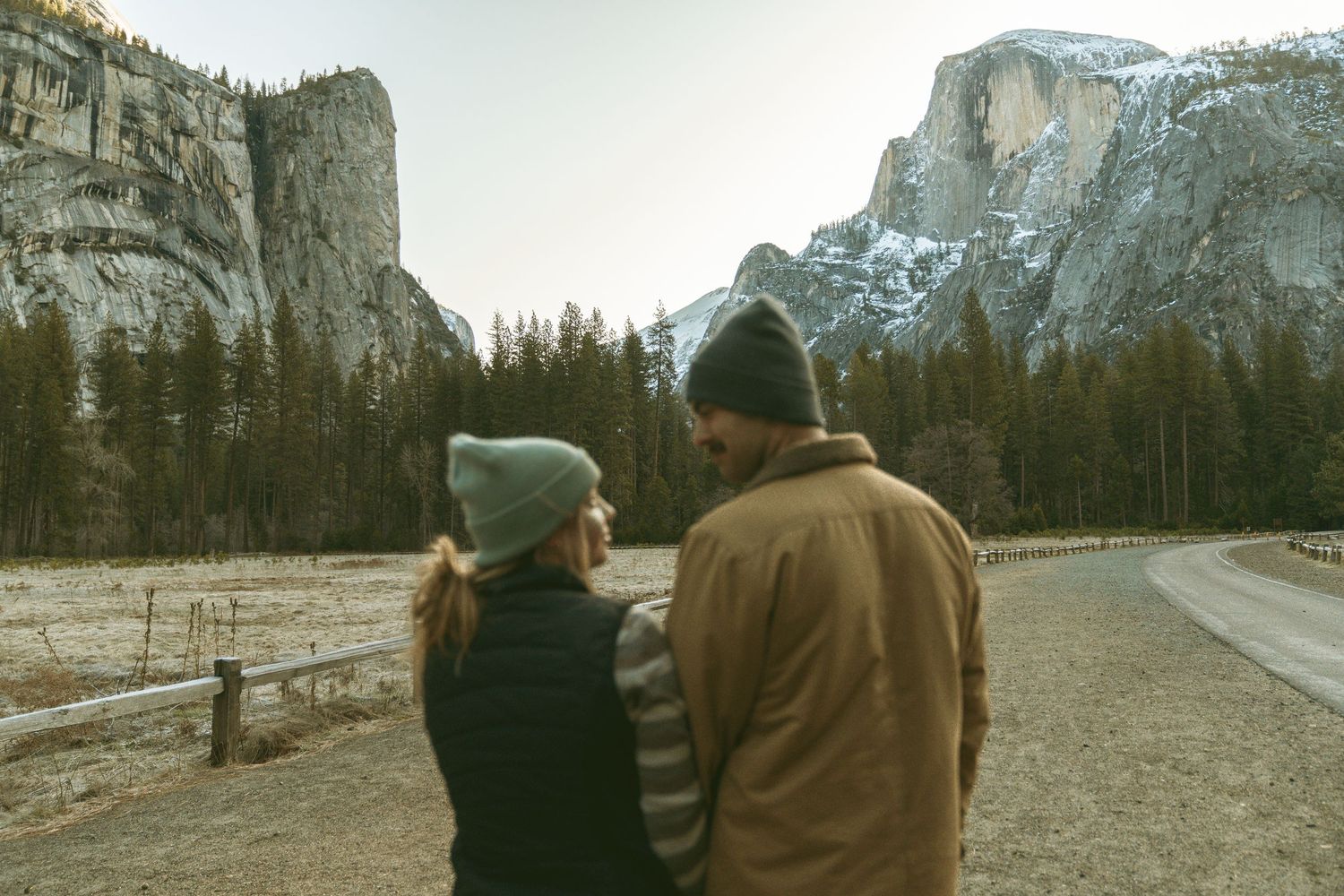 A couple admiring Yosemite's majestic valley views on a winter afternoon.