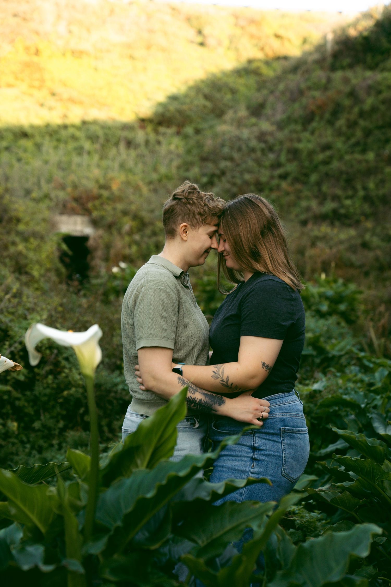 Couple in Cala lilies in Big Sur.