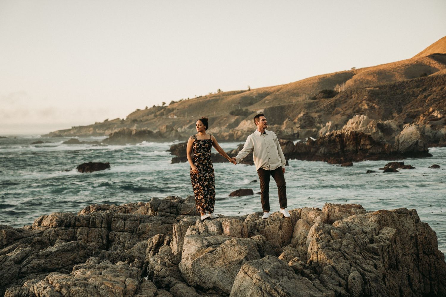 Scenic engagement session on rugged California coastline with dramatic ocean views.