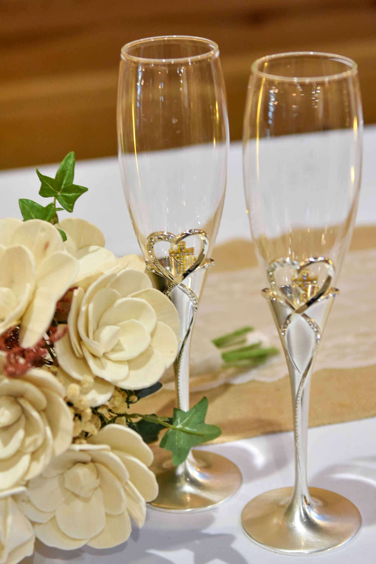 Detail image of bride and grooms champagne glasses at wedding reception