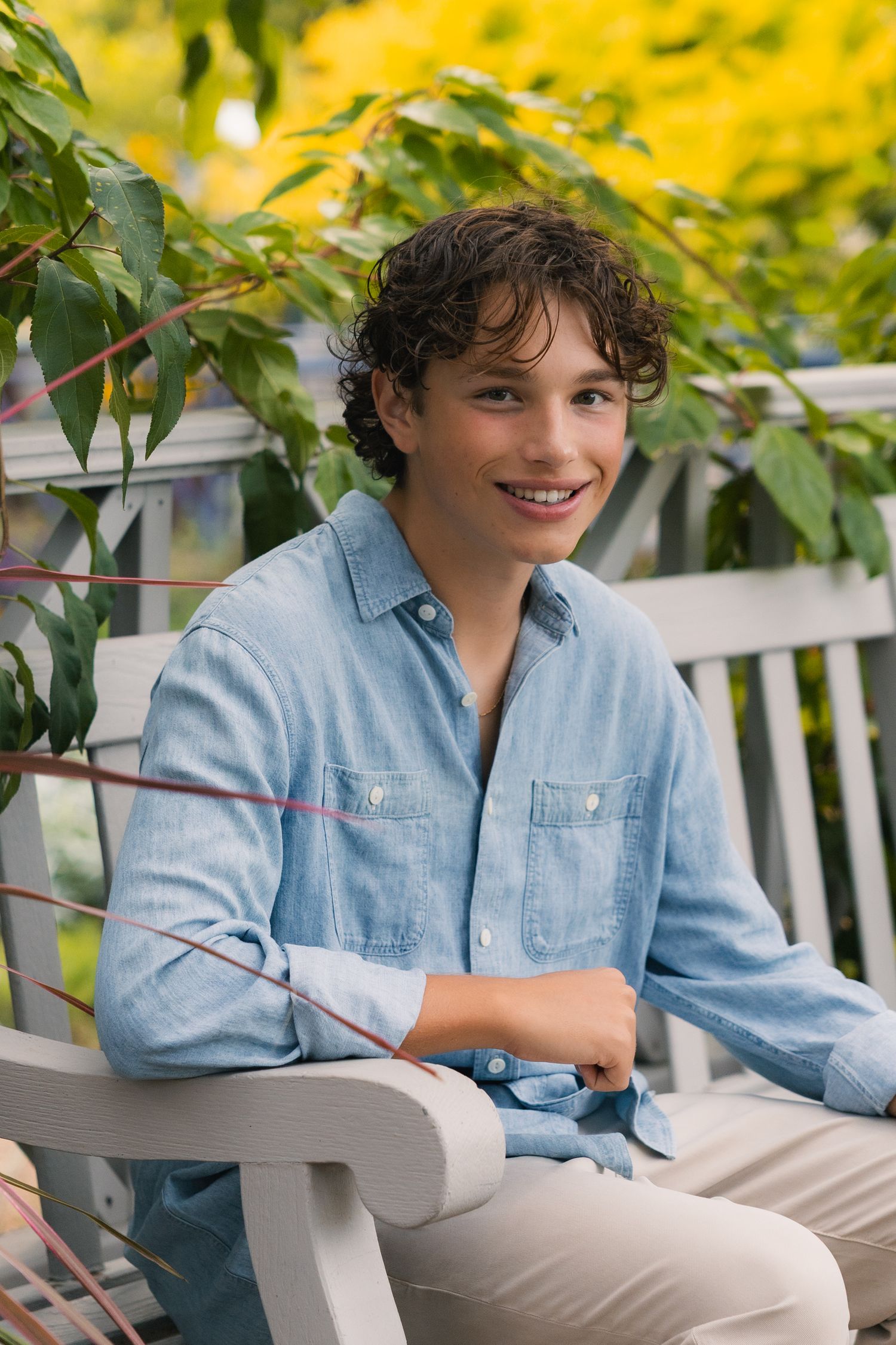 best photographer for senior portraits in Madison Wisconsin Little Dragan Photography allen centennial garden boy pose bench downtown vibes