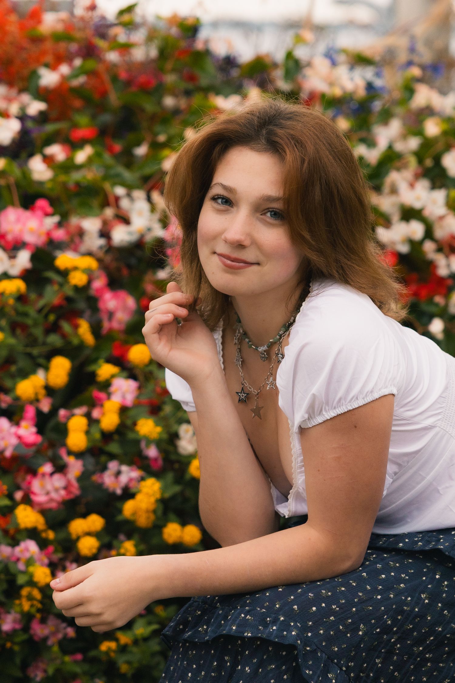 best senior portrait photographer in Madison, WI colorful flowers nature unique location downtown UW Campus true to color photos unique pose