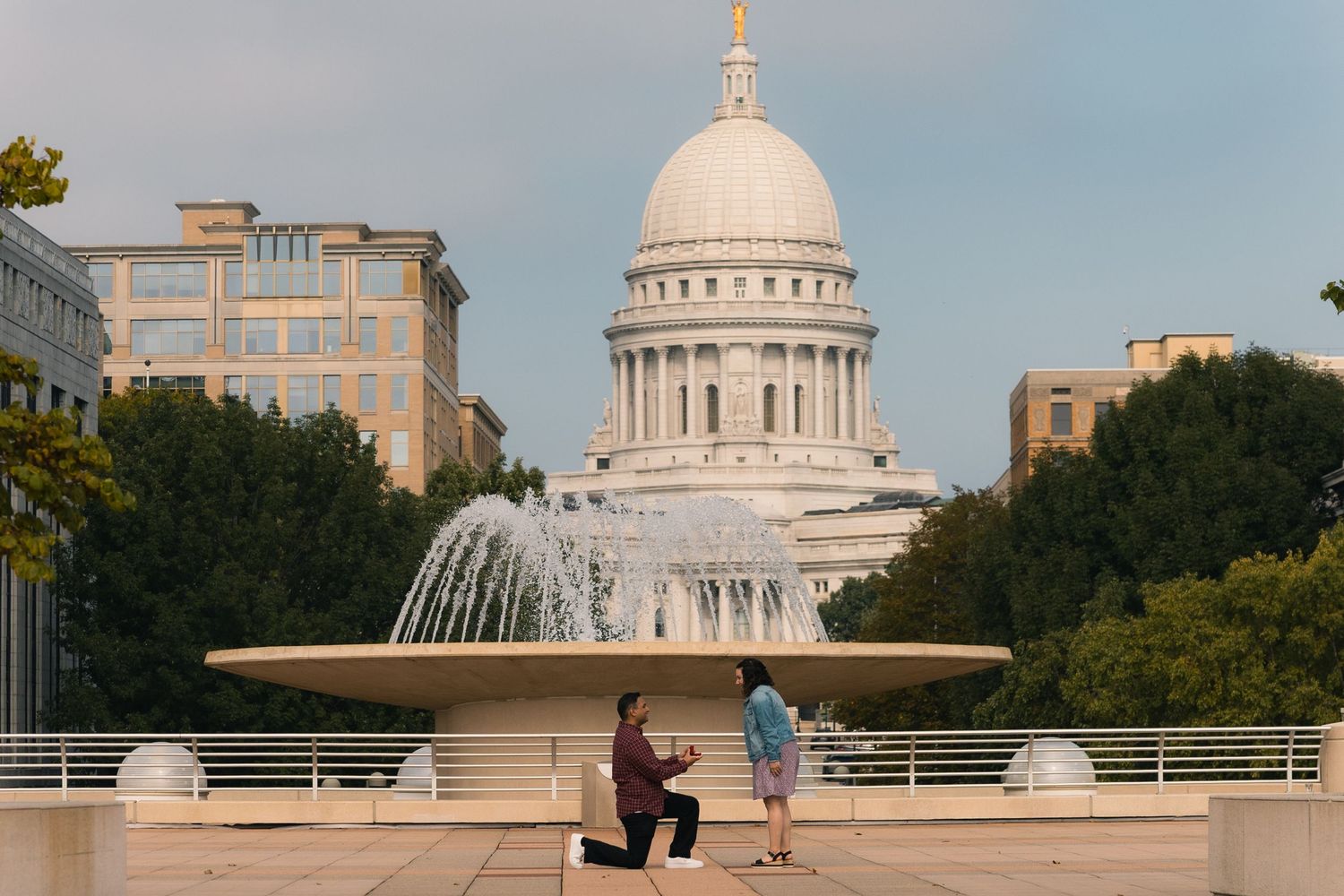 madison wi surprise secret proposal photographer engagement couples photos engaged downtown capitol building monona terrace state street