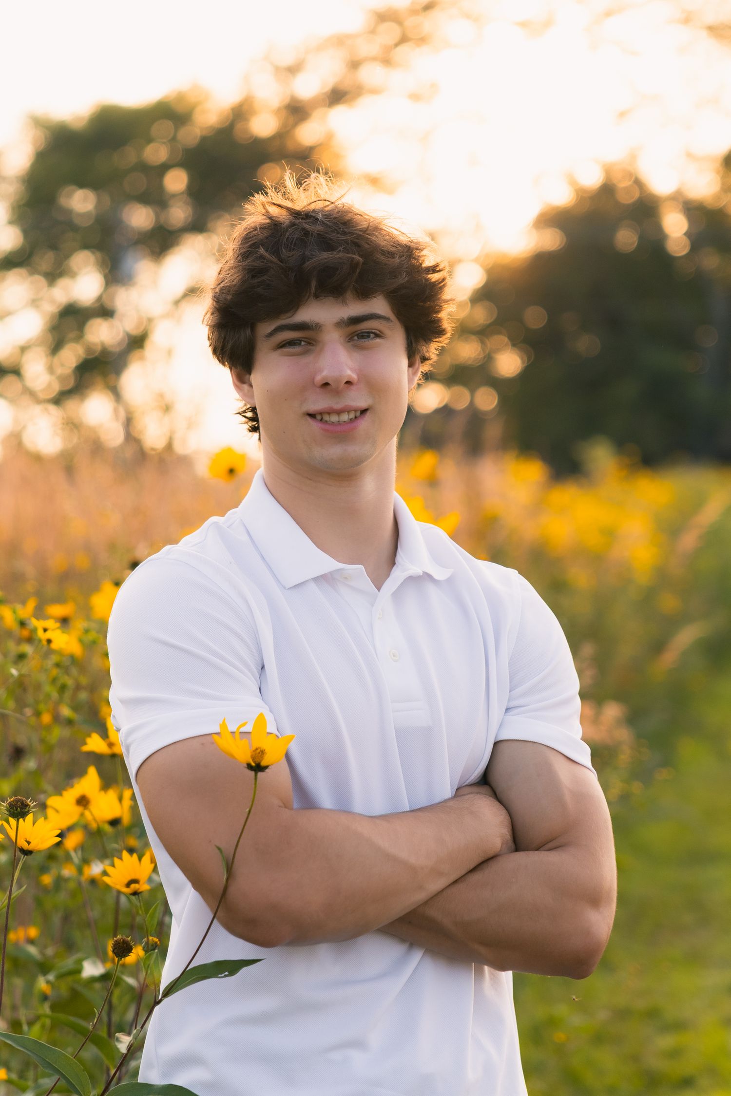 high school senior photographer in Madison, WI Little Dragan Photography golden hour boy white polo yellow wildflowers field pheasant branch