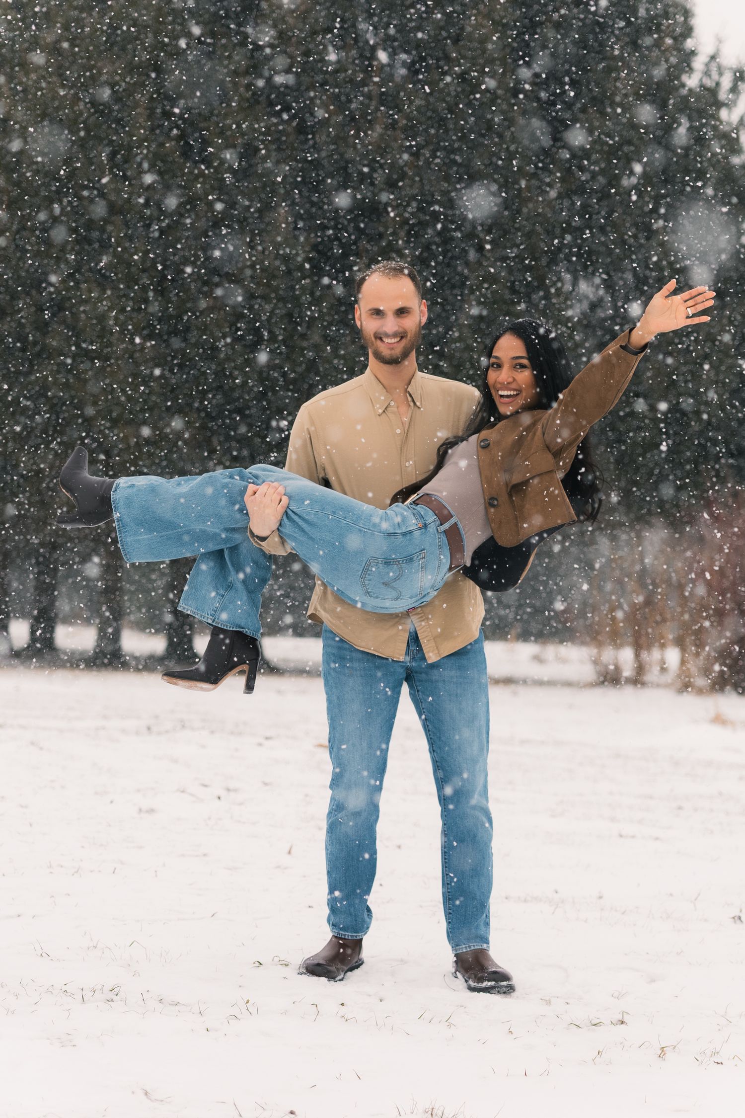 madison wi couples engagement photographer winter photoshoot snowy playing in snow outdoors proposal mcfarland waunakee verona sun prairie