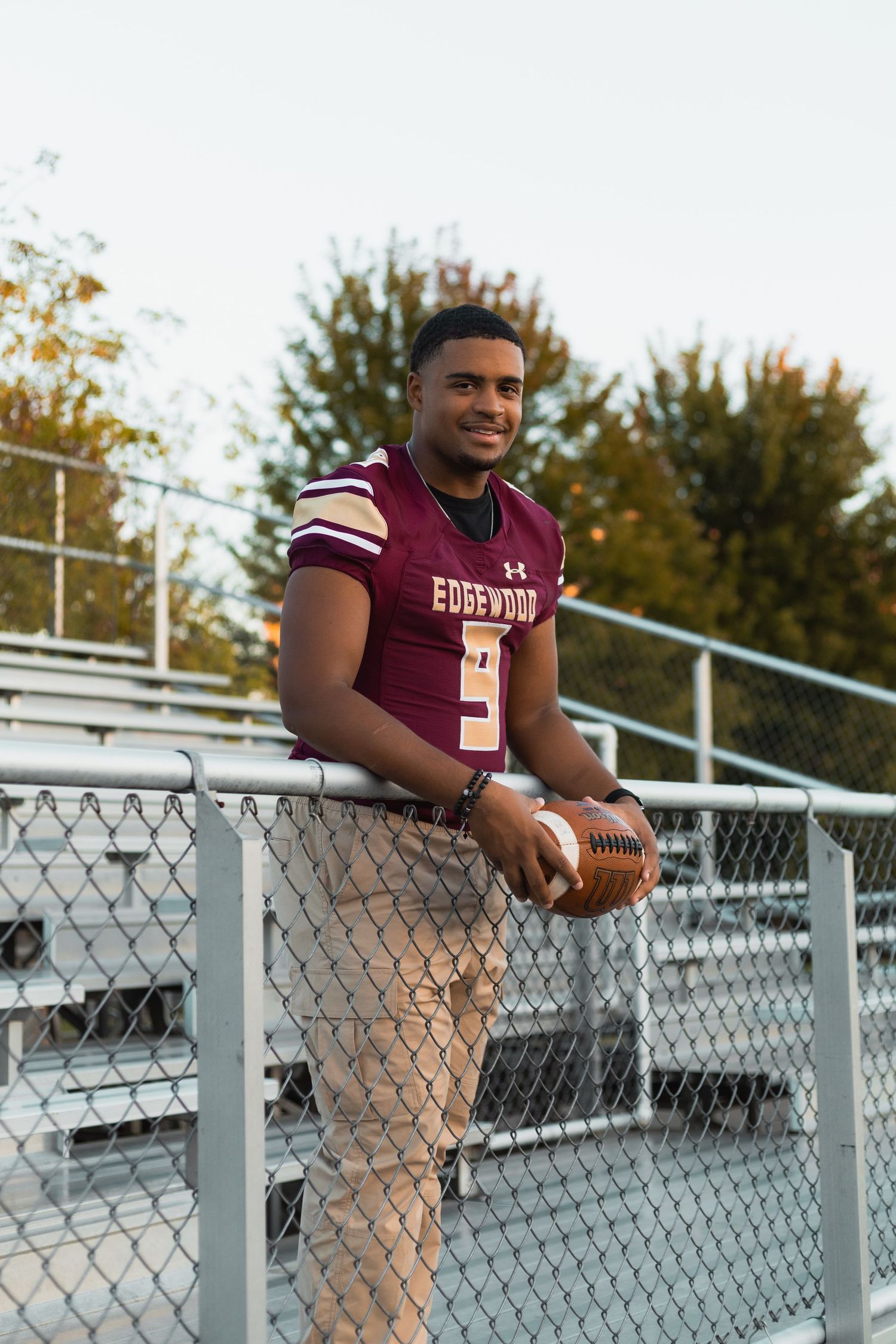 high school senior photographer in Madison, WI Little Dragan Photography edgewood bleachers football team uniform sport hobby portraits pics