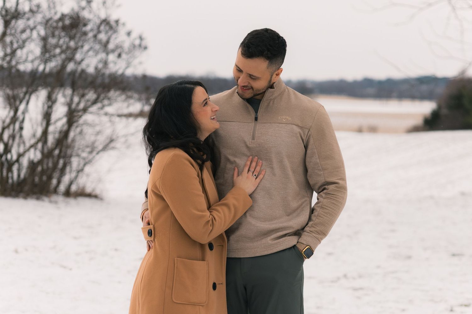 madison wi couples engagement photographer winter photoshoot snowy playing in snow outdoors proposal mcfarland waunakee verona sun prairie